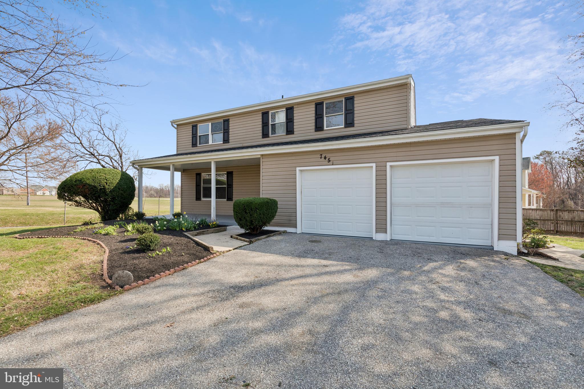 7451 Oakland Mills Road Columbia, MD 21046 - Photo 6 of 83 a house view with a outdoor space
