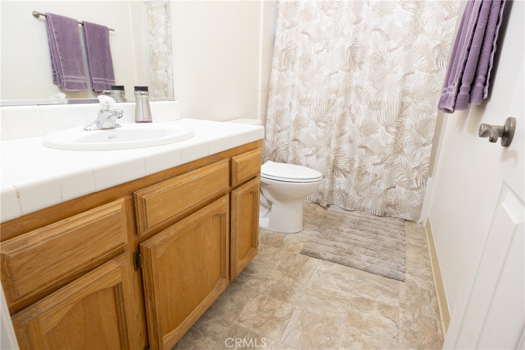 30142 Revis Road Coarsegold, CA 93614 - Photo 17 of 43 a bathroom with a sink toilet and shower