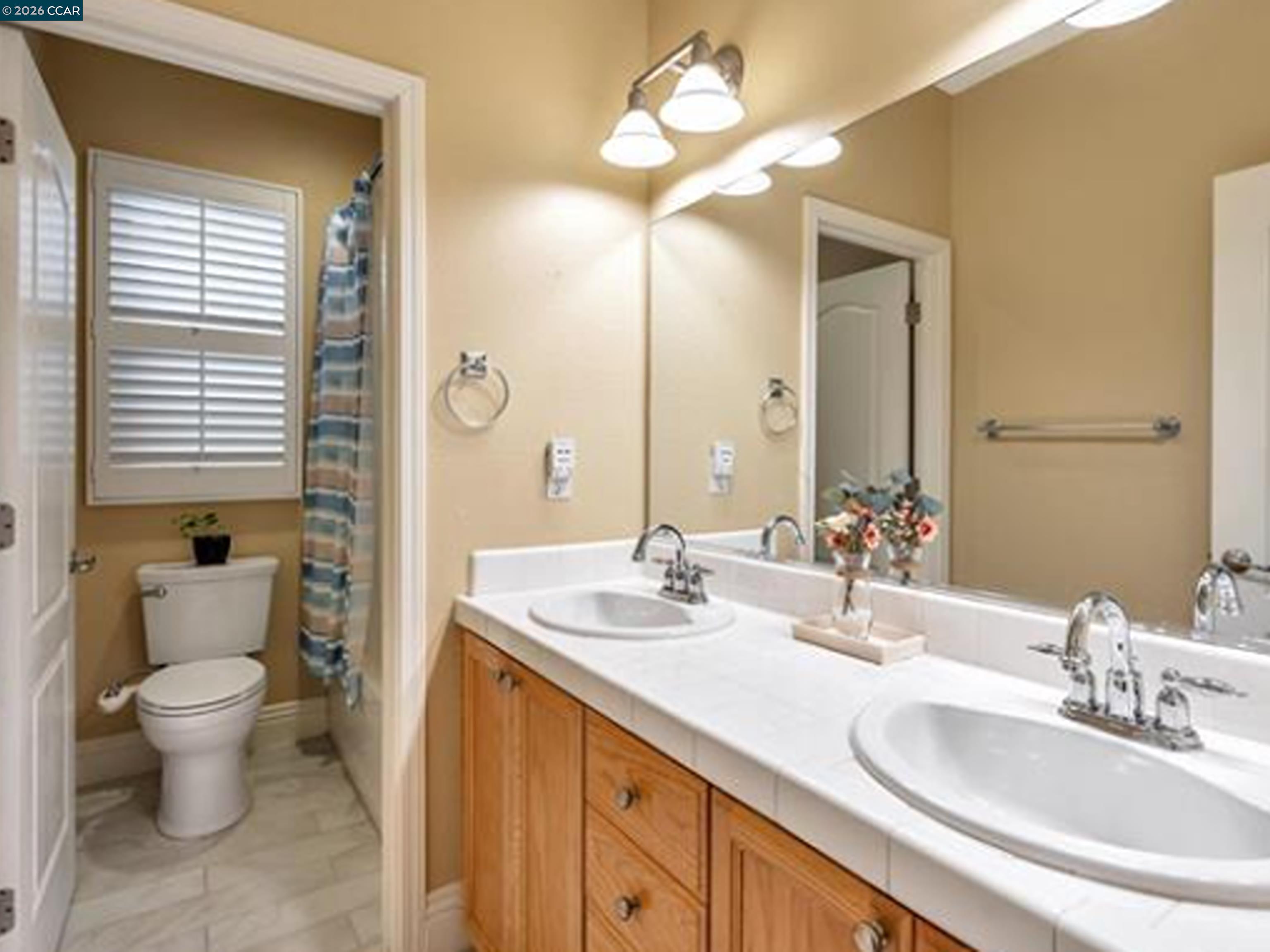 2036 Serra Lane Hercules, CA 94547 - Photo 17 of 50 a bathroom with a double vanity sink and a mirror
