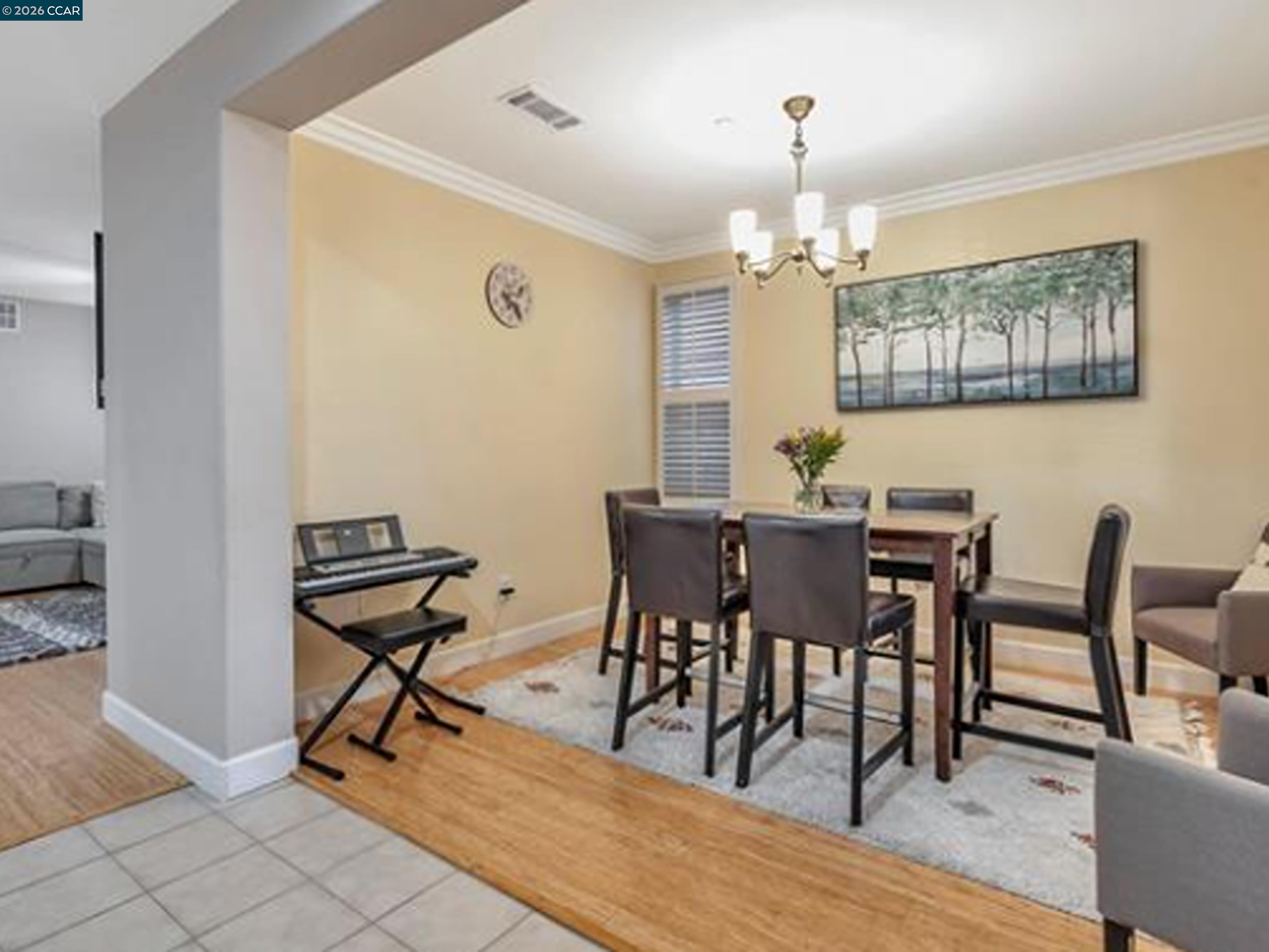 2036 Serra Lane Hercules, CA 94547 - Photo 29 of 50 a view of a dining room with furniture and a chandelier