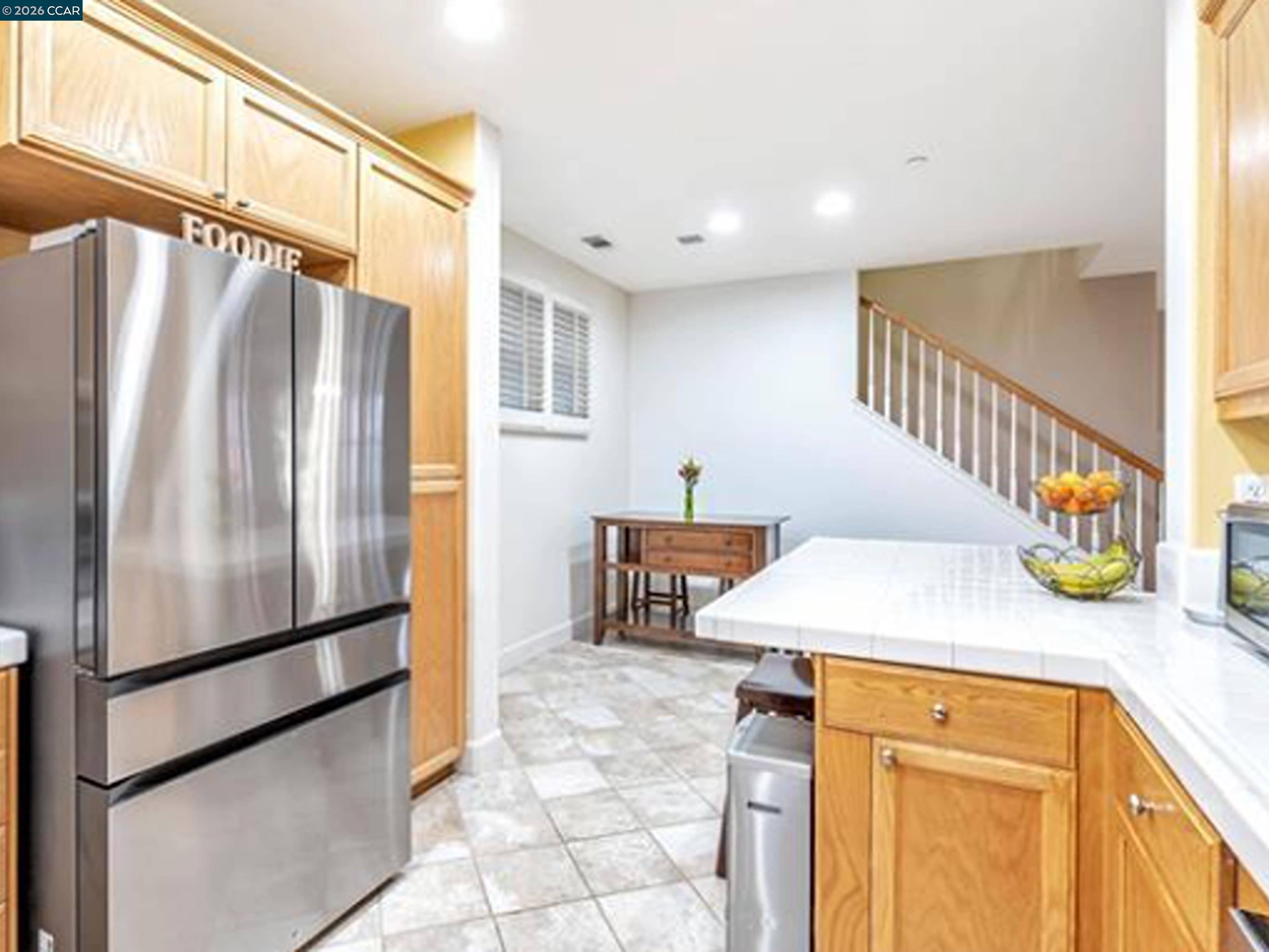 2036 Serra Lane Hercules, CA 94547 - Photo 36 of 50 a kitchen with stainless steel appliances a refrigerator and a stove top oven