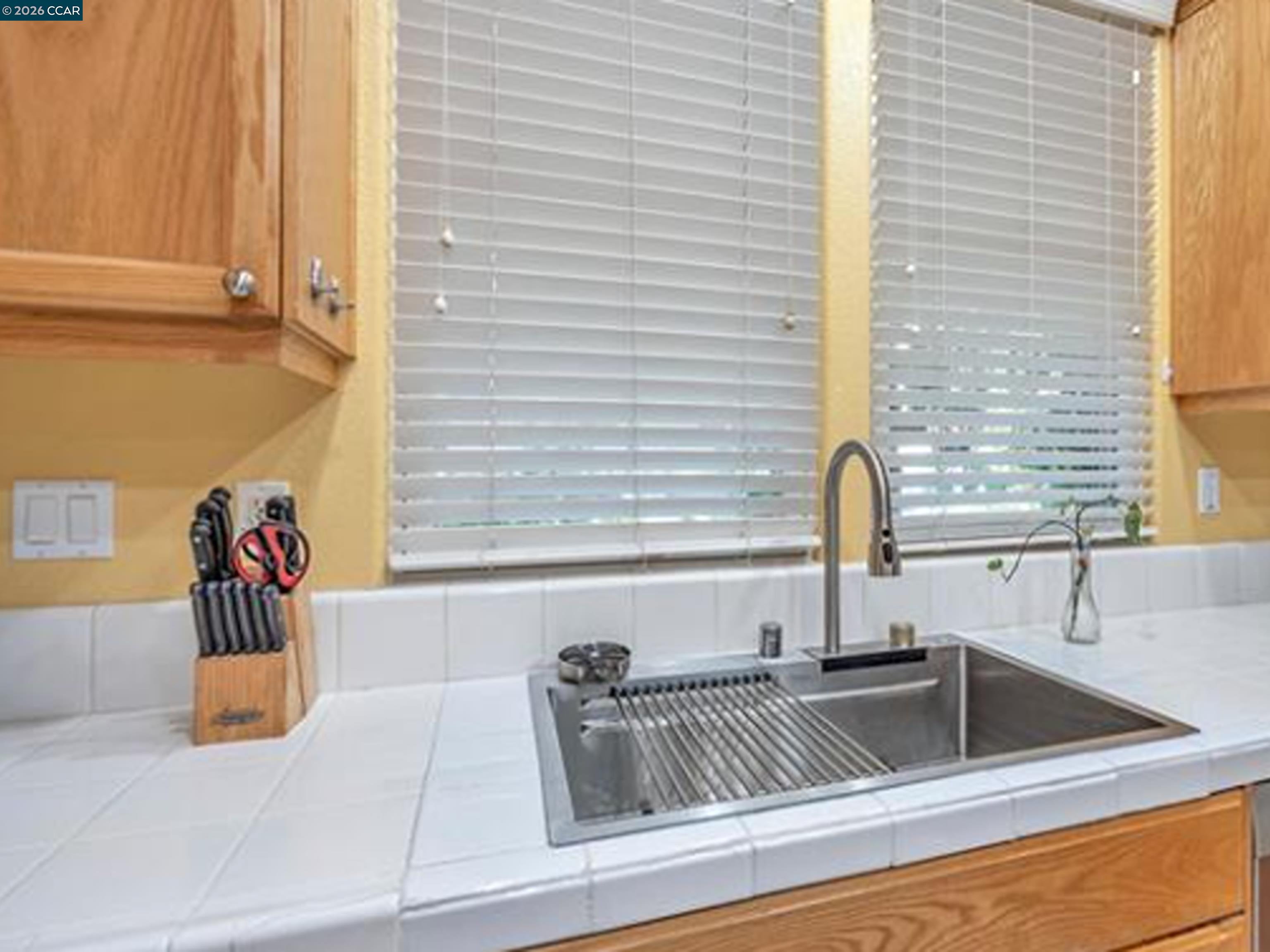 2036 Serra Lane Hercules, CA 94547 - Photo 38 of 50 a kitchen with a sink and a window