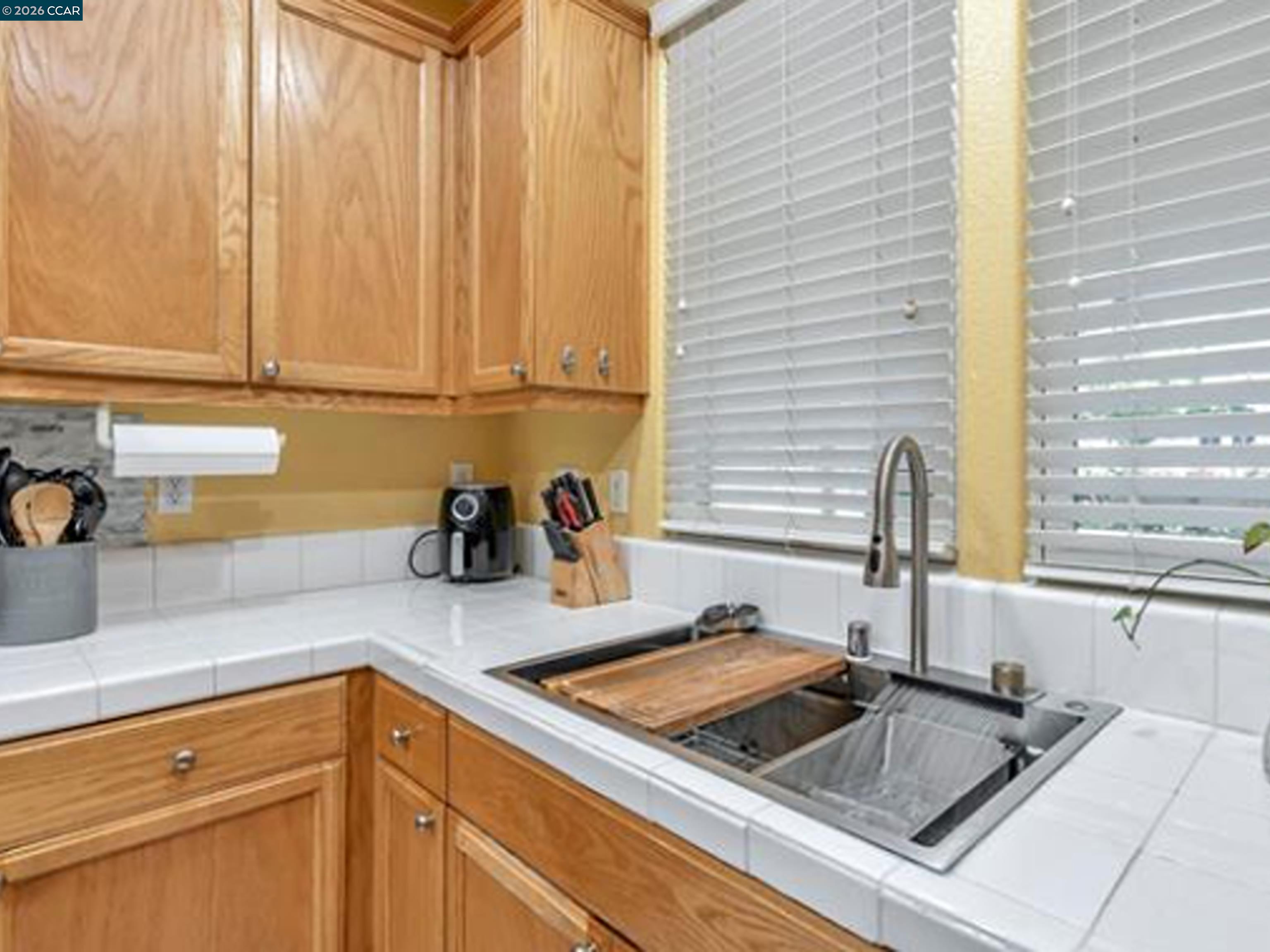 2036 Serra Lane Hercules, CA 94547 - Photo 39 of 50 a kitchen with a sink stove and cabinets