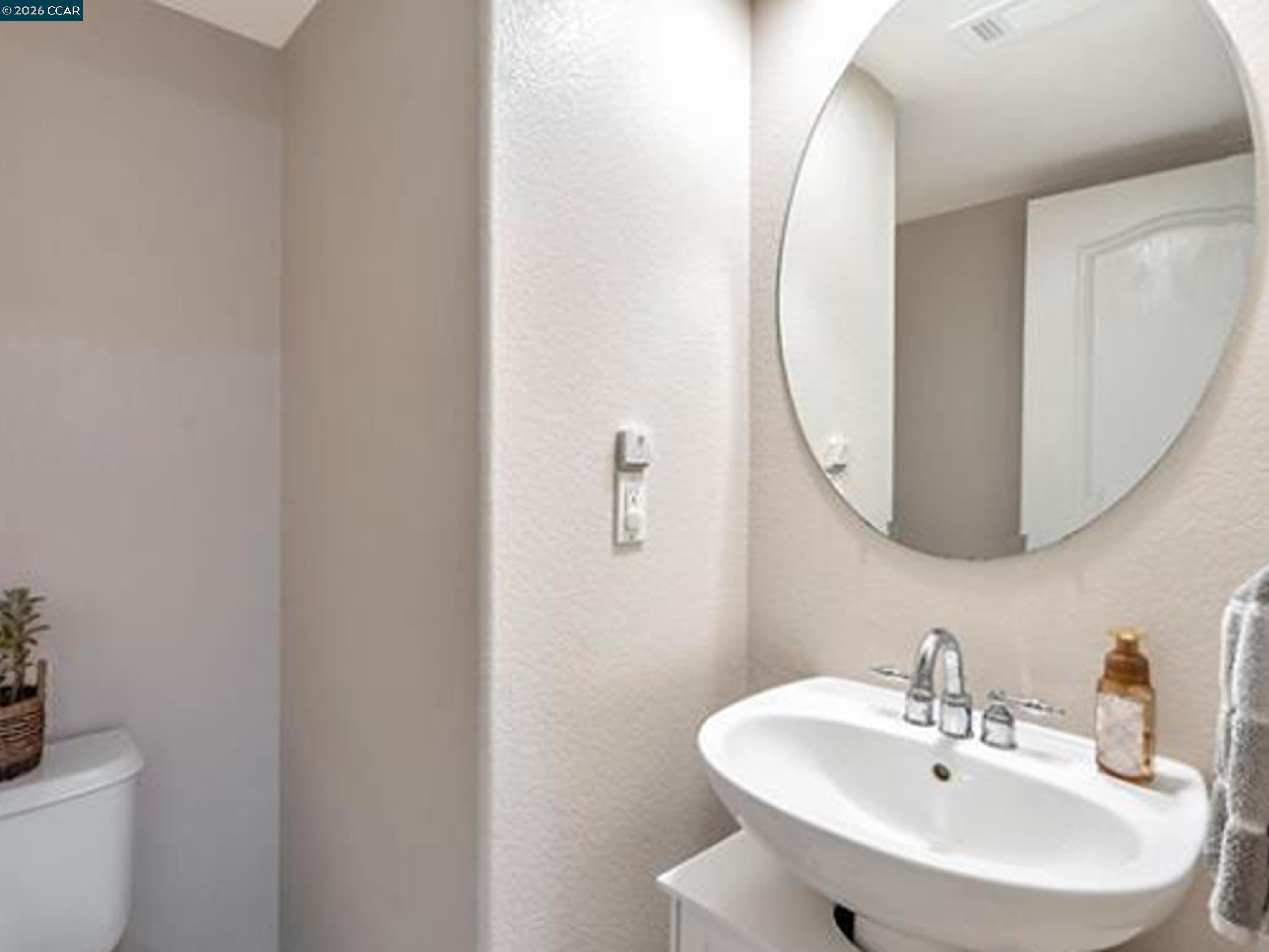 2036 Serra Lane Hercules, CA 94547 - Photo 40 of 50 a bathroom with a sink and a mirror