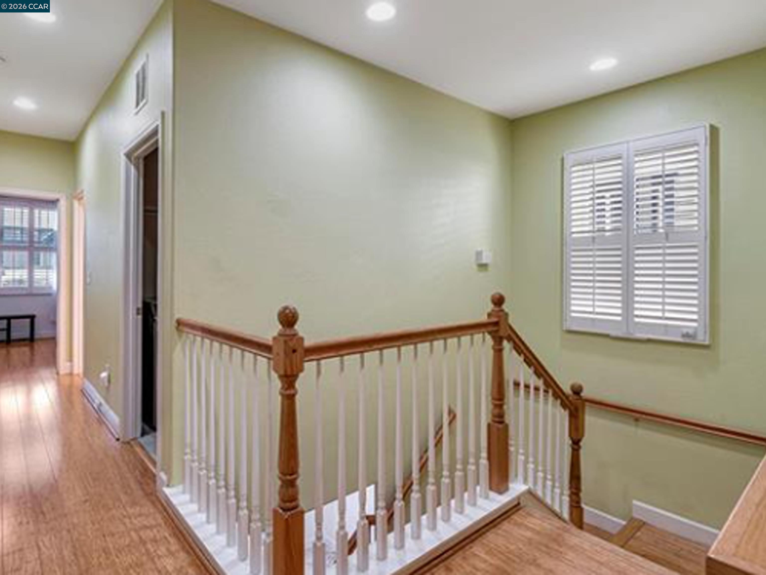 2036 Serra Lane Hercules, CA 94547 - Photo 41 of 50 a view of a hallway with a wooden floor and windows