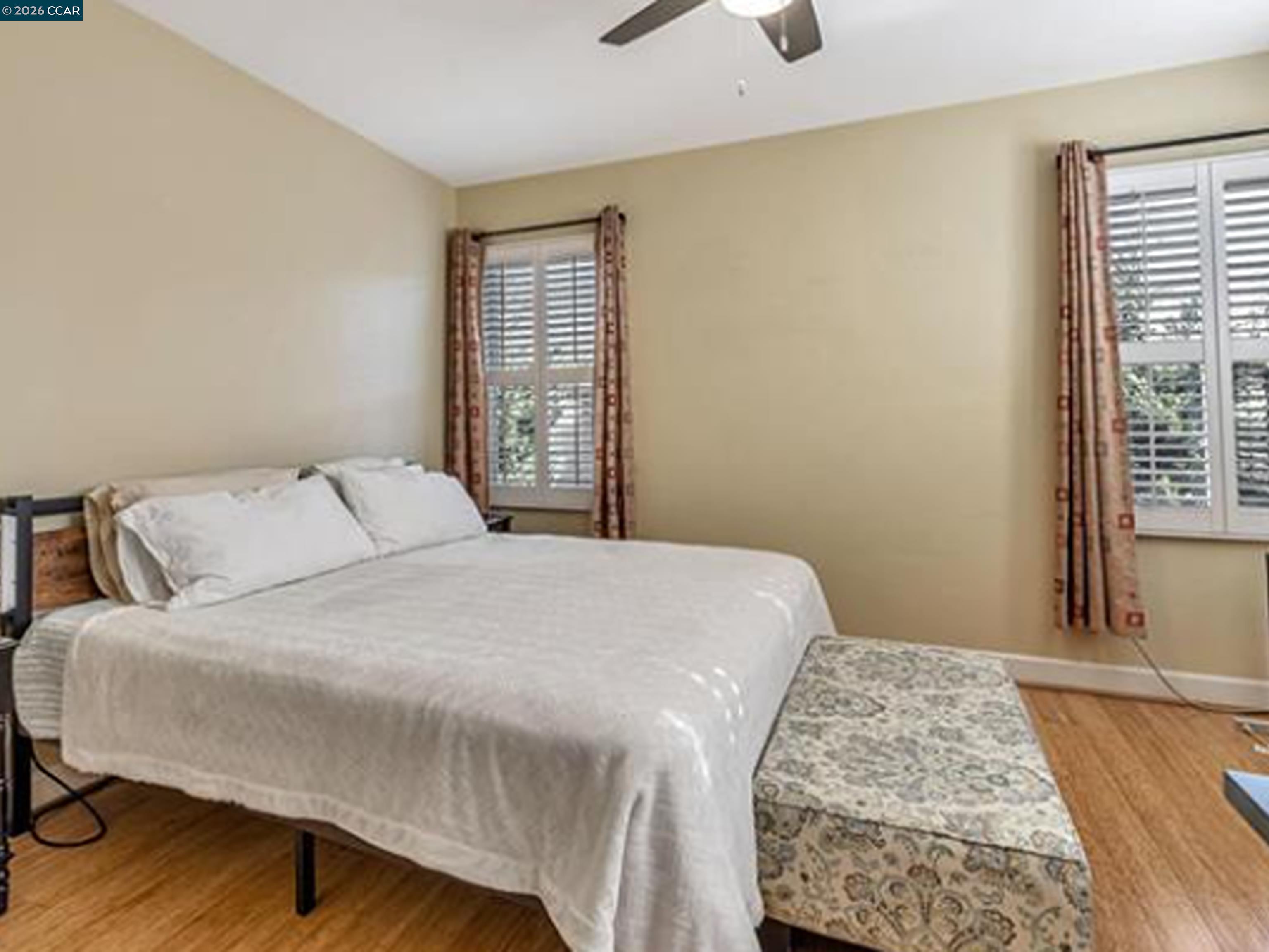 2036 Serra Lane Hercules, CA 94547 - Photo 44 of 50 a bedroom with a bed and wooden floor