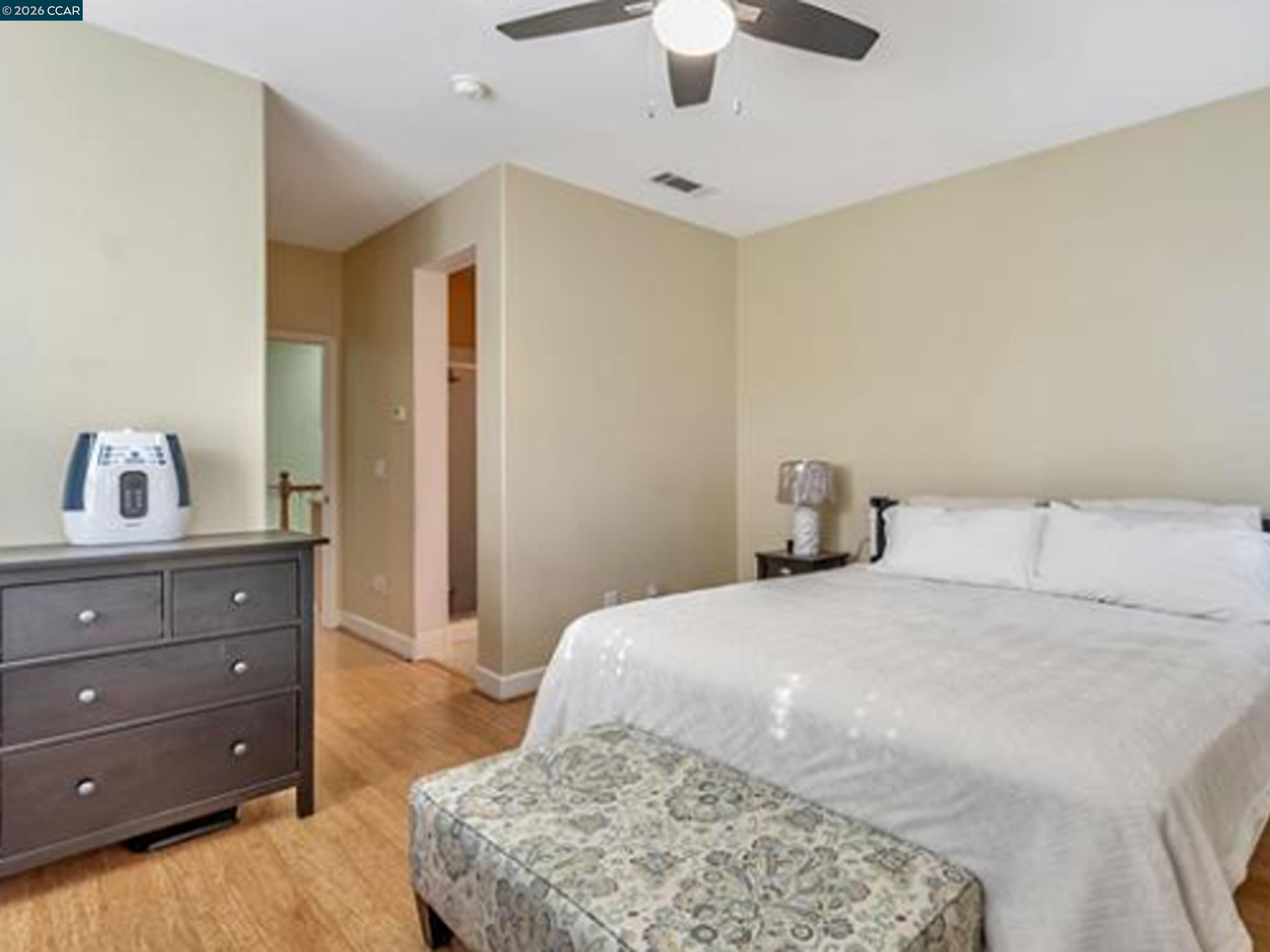 2036 Serra Lane Hercules, CA 94547 - Photo 45 of 50 a bedroom with a bed and a dresser