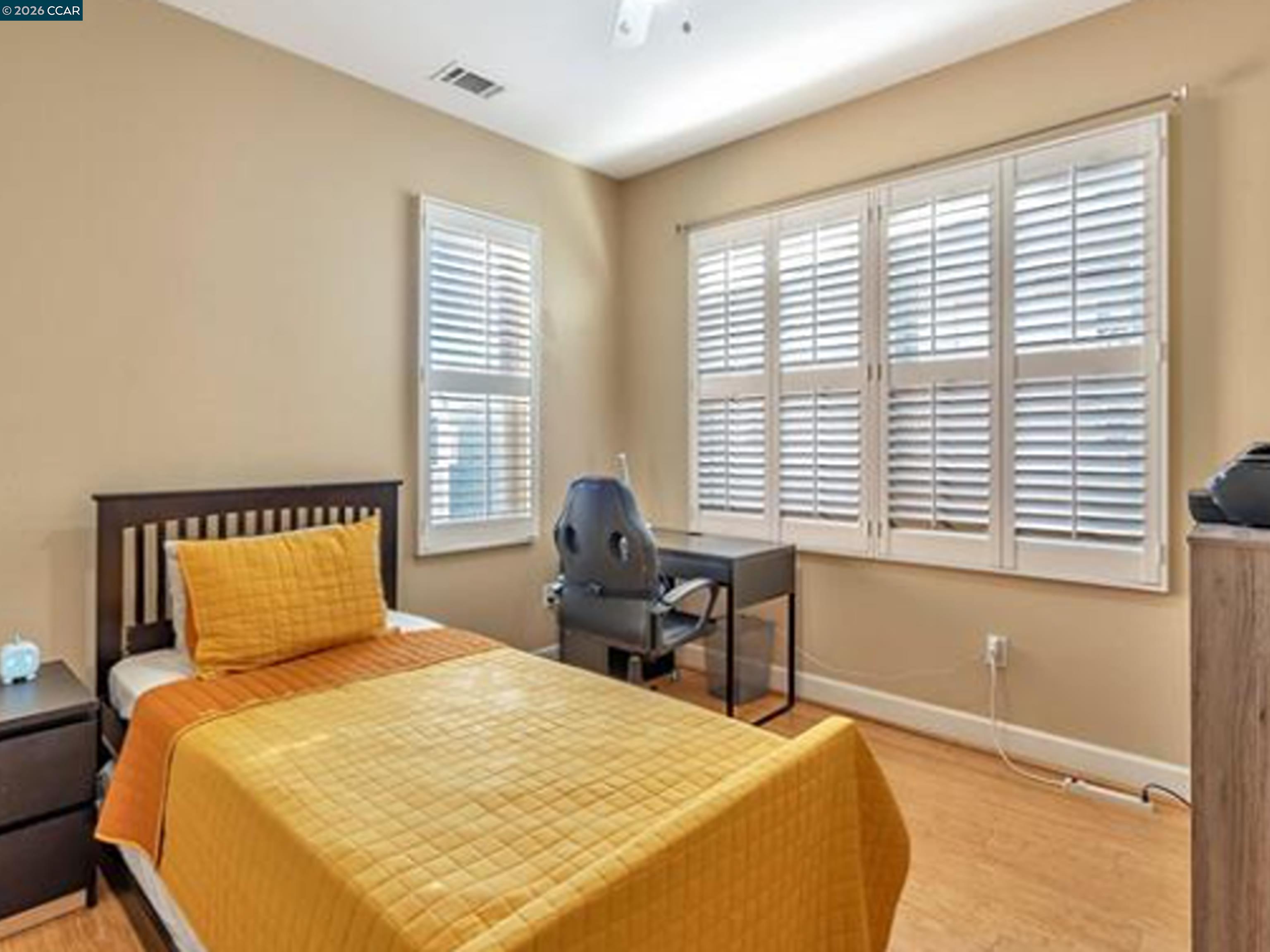 2036 Serra Lane Hercules, CA 94547 - Photo 46 of 50 a bedroom with a large bed and a window