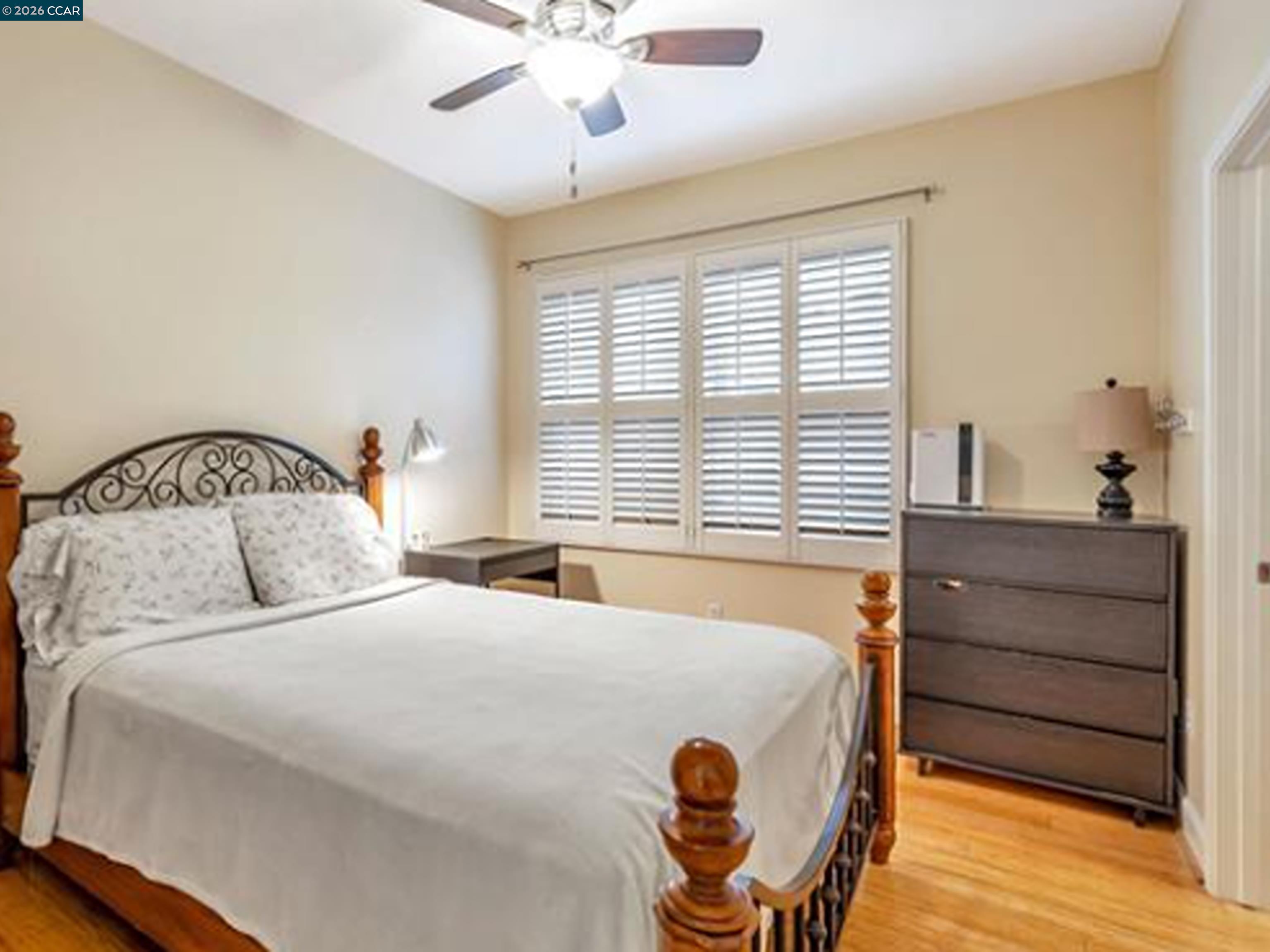 2036 Serra Lane Hercules, CA 94547 - Photo 47 of 50 a bedroom with a bed and a chandelier