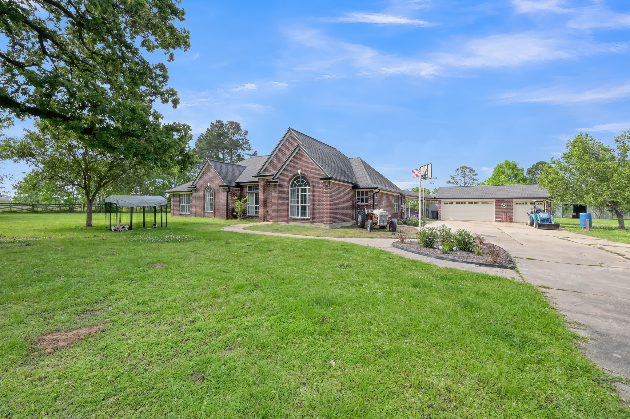 251 Petty Road Waller, TX 77484 - Photo 2 of 25 a front view of a house with garden
