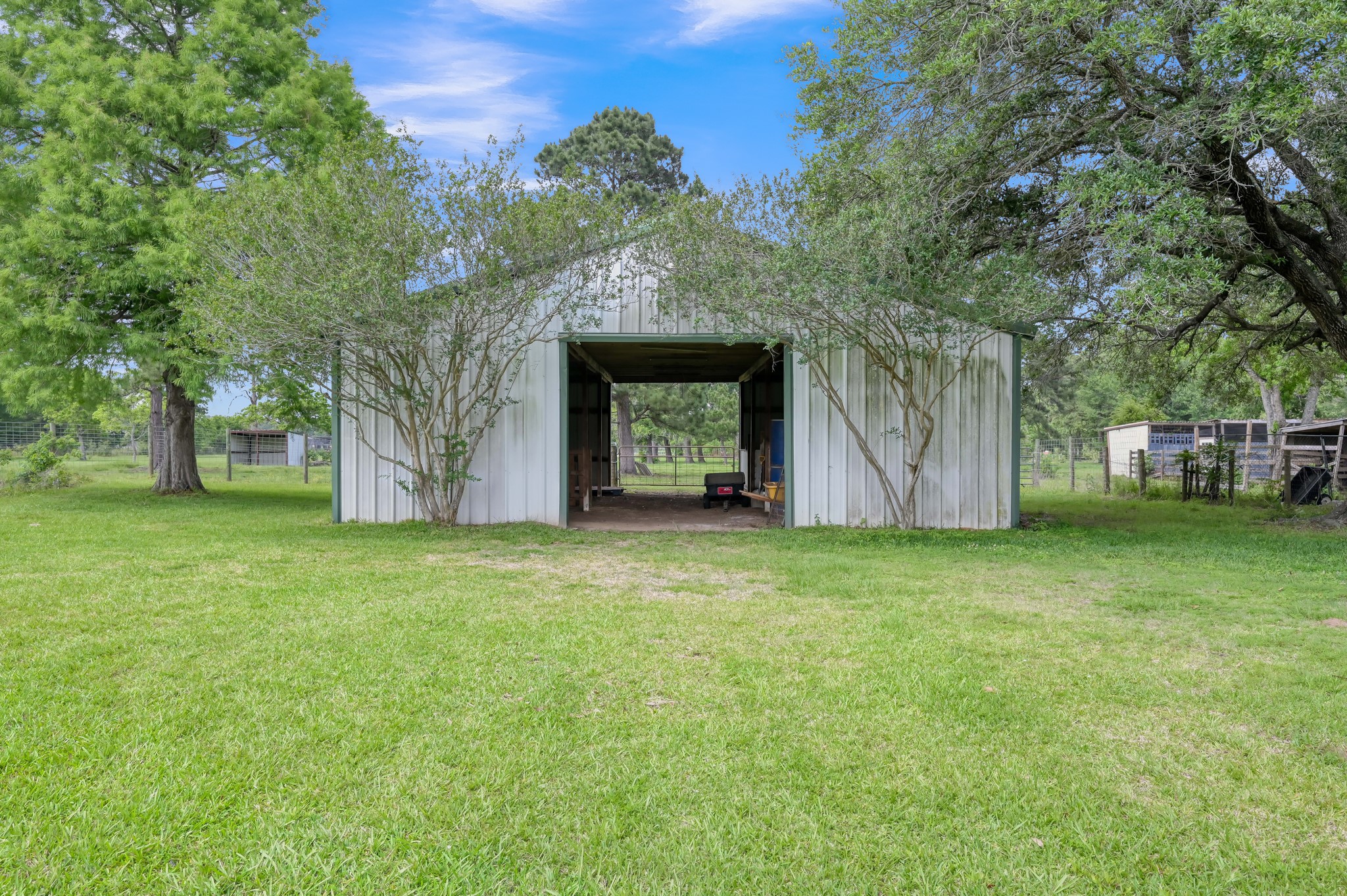 251 Petty Road Waller, TX 77484 - Photo 21 of 25 a front view of a house with garden