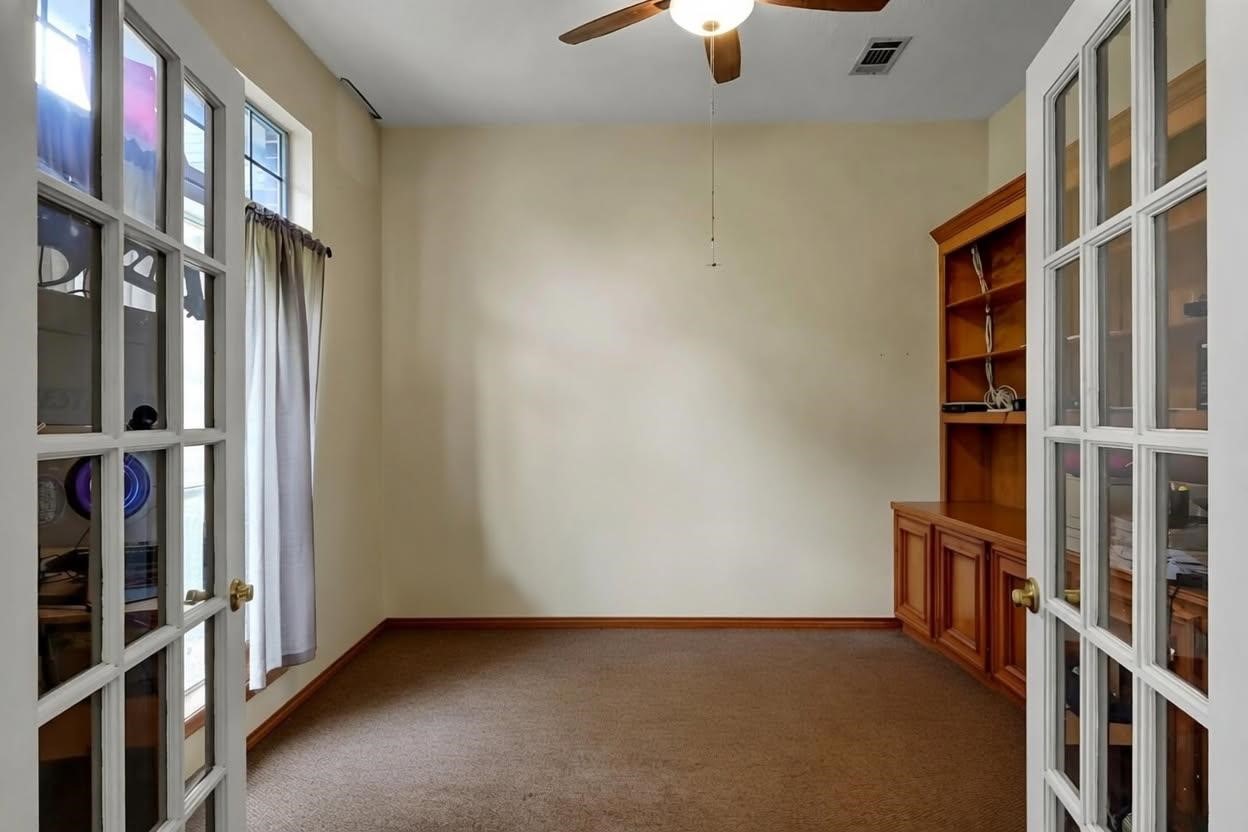 251 Petty Road Waller, TX 77484 - Photo 5 of 25 a view of an empty room with stairs