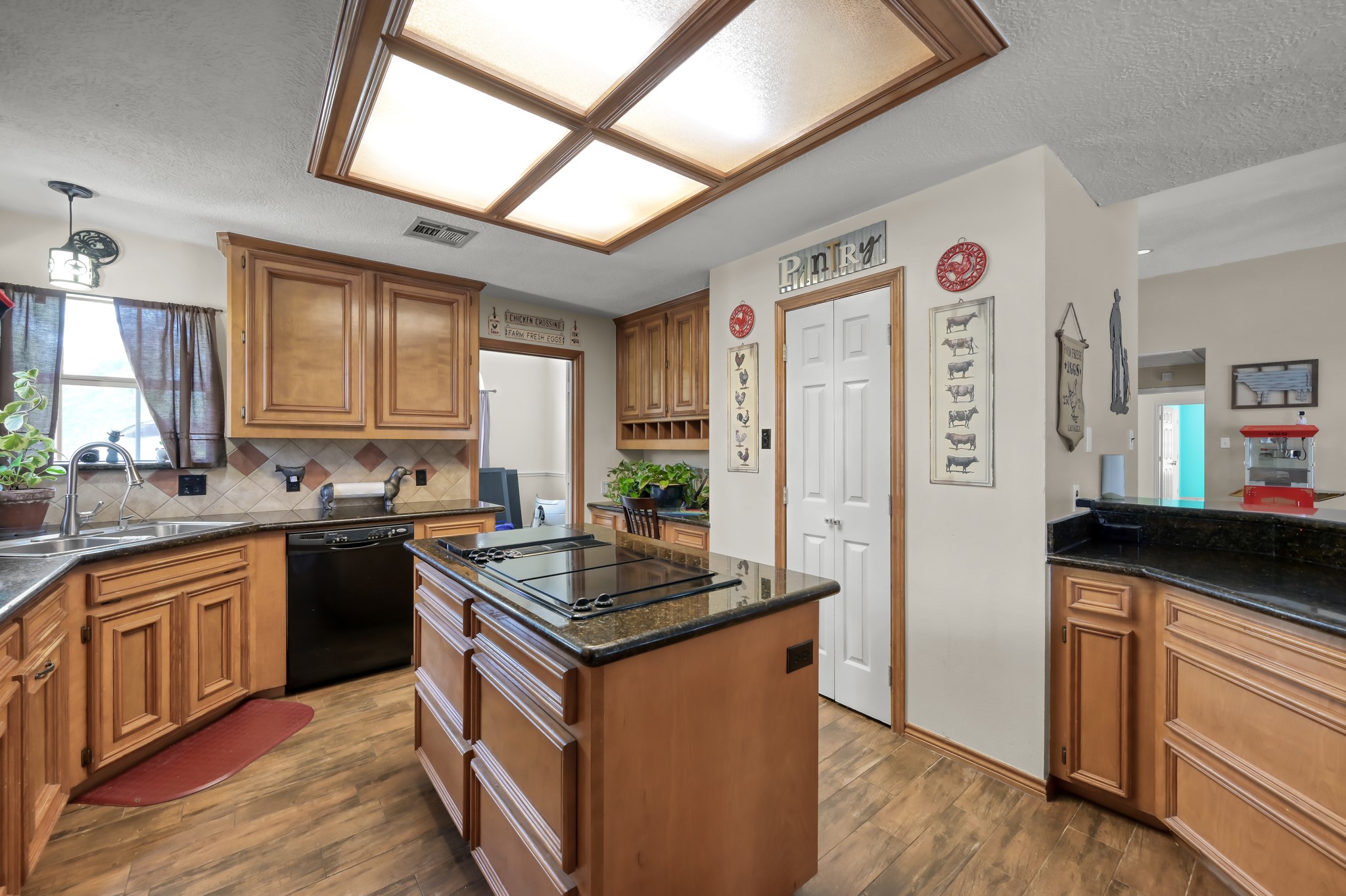251 Petty Road Waller, TX 77484 - Photo 6 of 25 a kitchen with stainless steel appliances granite countertop a stove and a sink