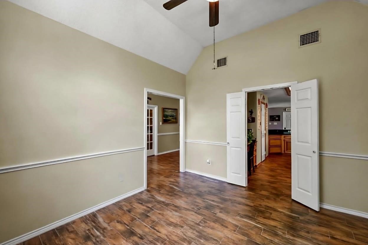 251 Petty Road Waller, TX 77484 - Photo 8 of 25 a view of empty room with wooden floor