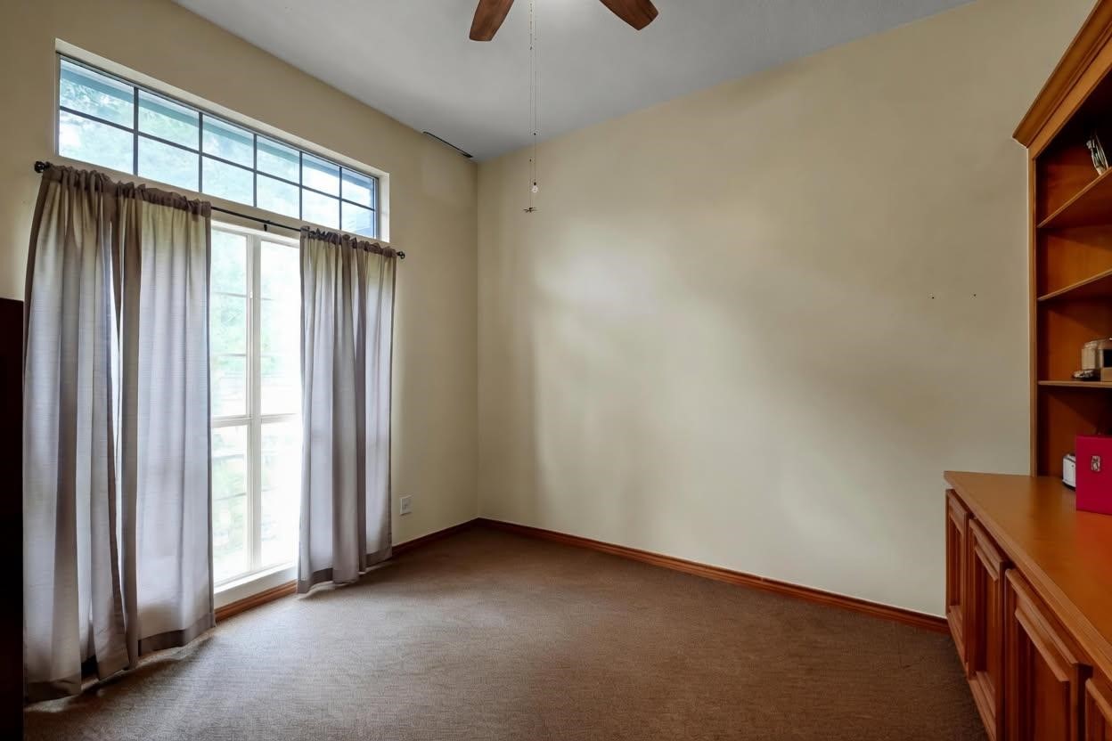 251 Petty Road Waller, TX 77484 - Photo 9 of 25 an empty room with a empty space and a window