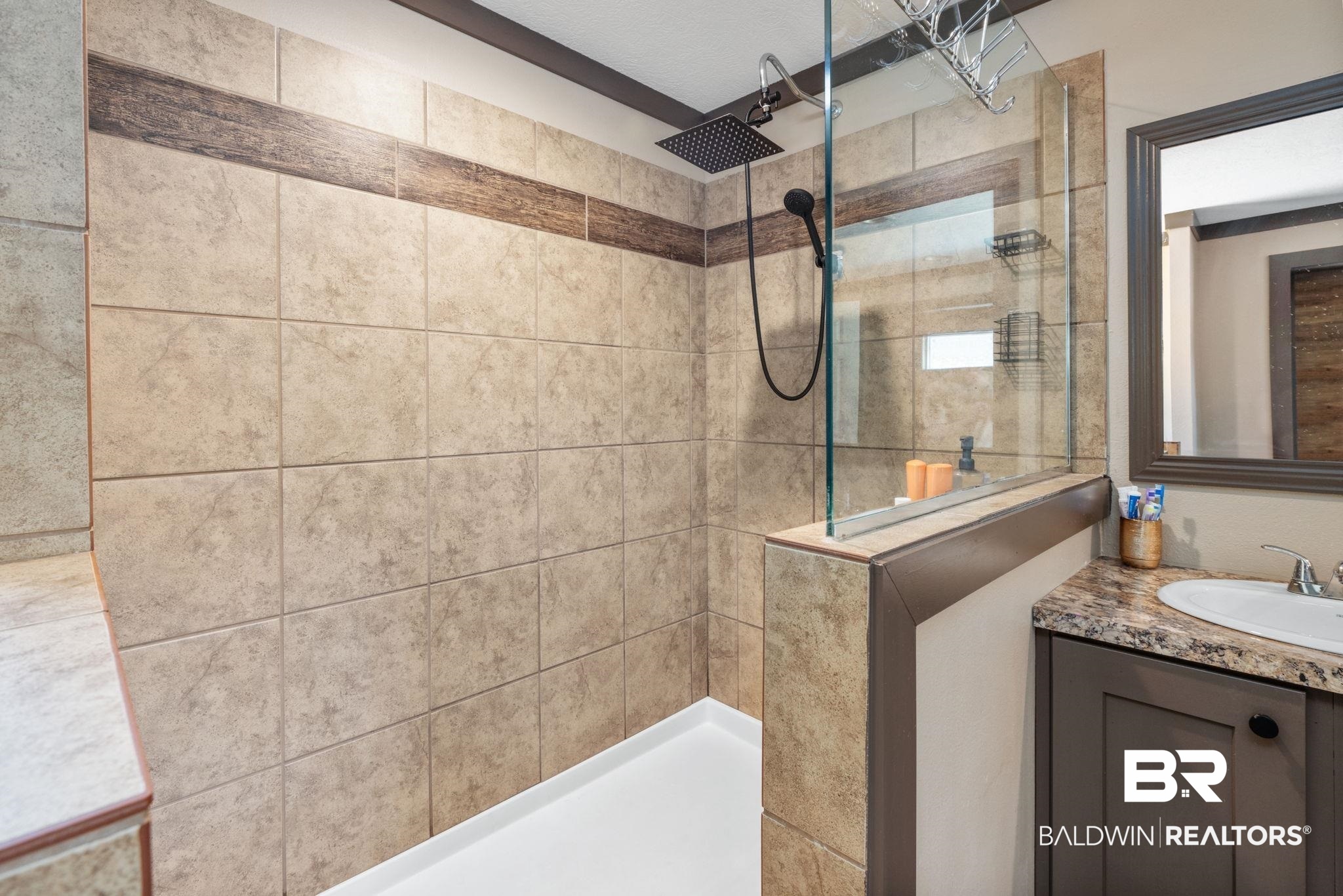 15080 Starlight Avenue Wilmer, AL 36587 - Photo 19 of 29 Bathroom with vanity and a tile shower