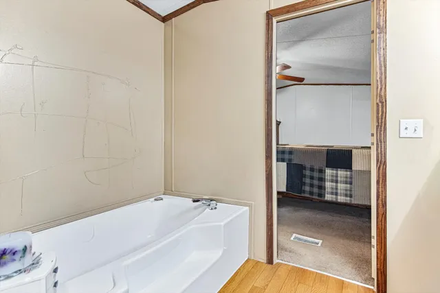 a en suite bathroom with a sink and mirror