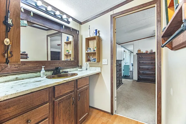 a bathroom with a window and a shower