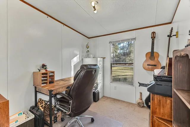 a workspace with furniture and window