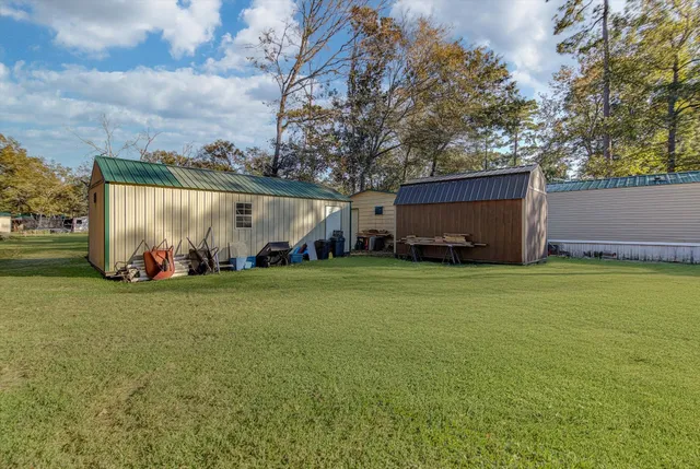 a backyard of a house with lots of green space