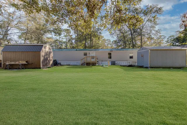 a backyard of a house with lots of green space