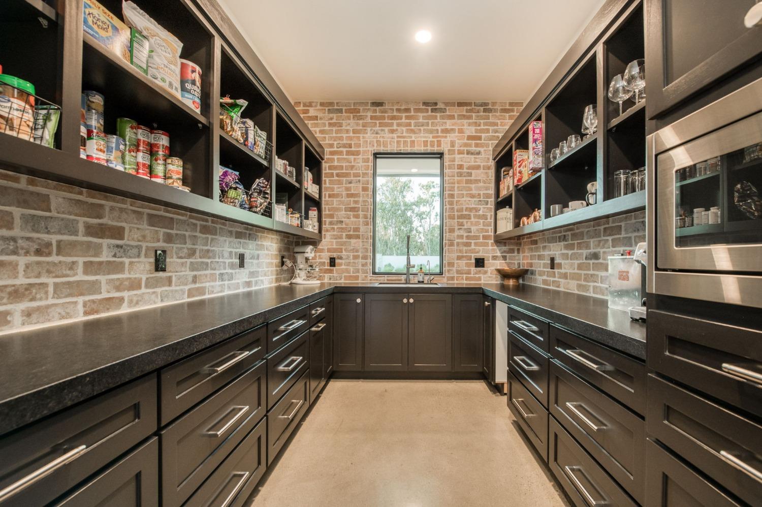 3895 East Reno Avenue Clovis, CA 93619 - Photo 17 of 67 a kitchen with granite countertop stainless steel appliances and counter space