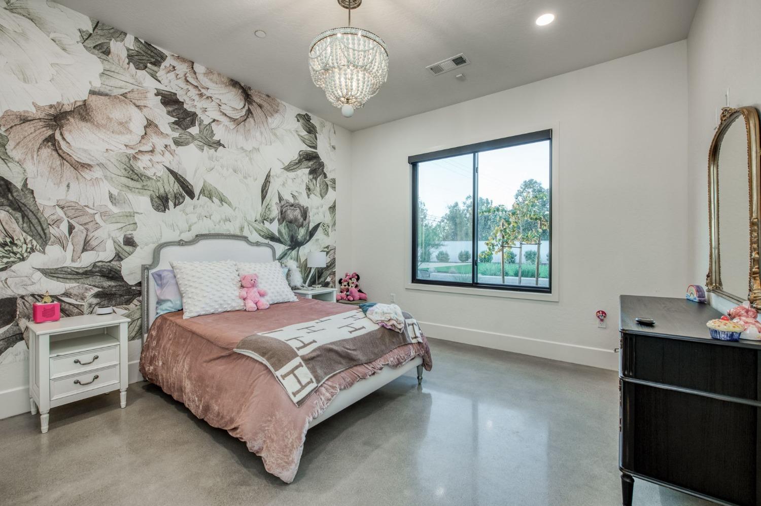 3895 East Reno Avenue Clovis, CA 93619 - Photo 32 of 67 a bedroom with a bed and a window