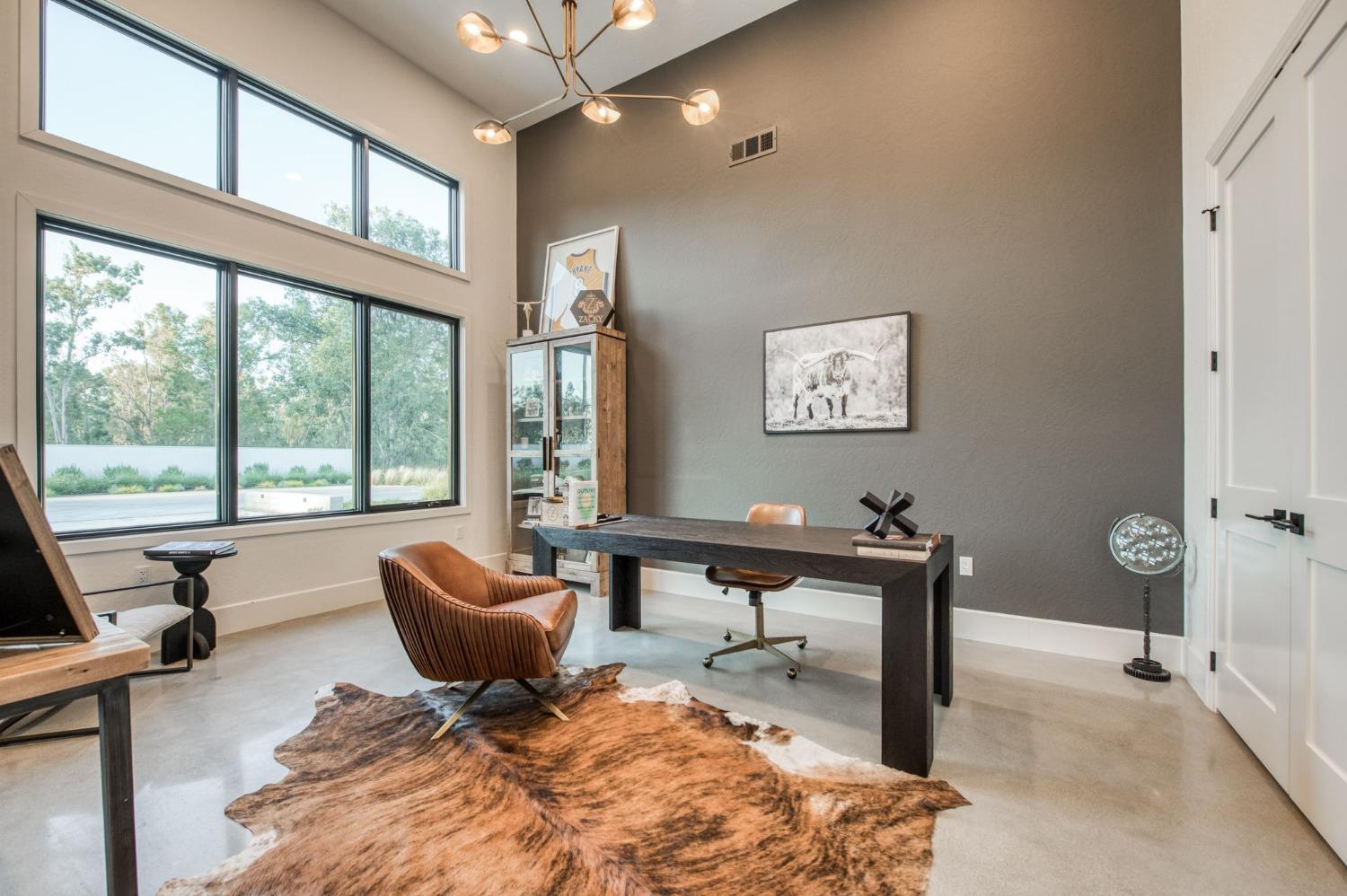 3895 East Reno Avenue Clovis, CA 93619 - Photo 5 of 67 a living room with furniture a rug and a large window