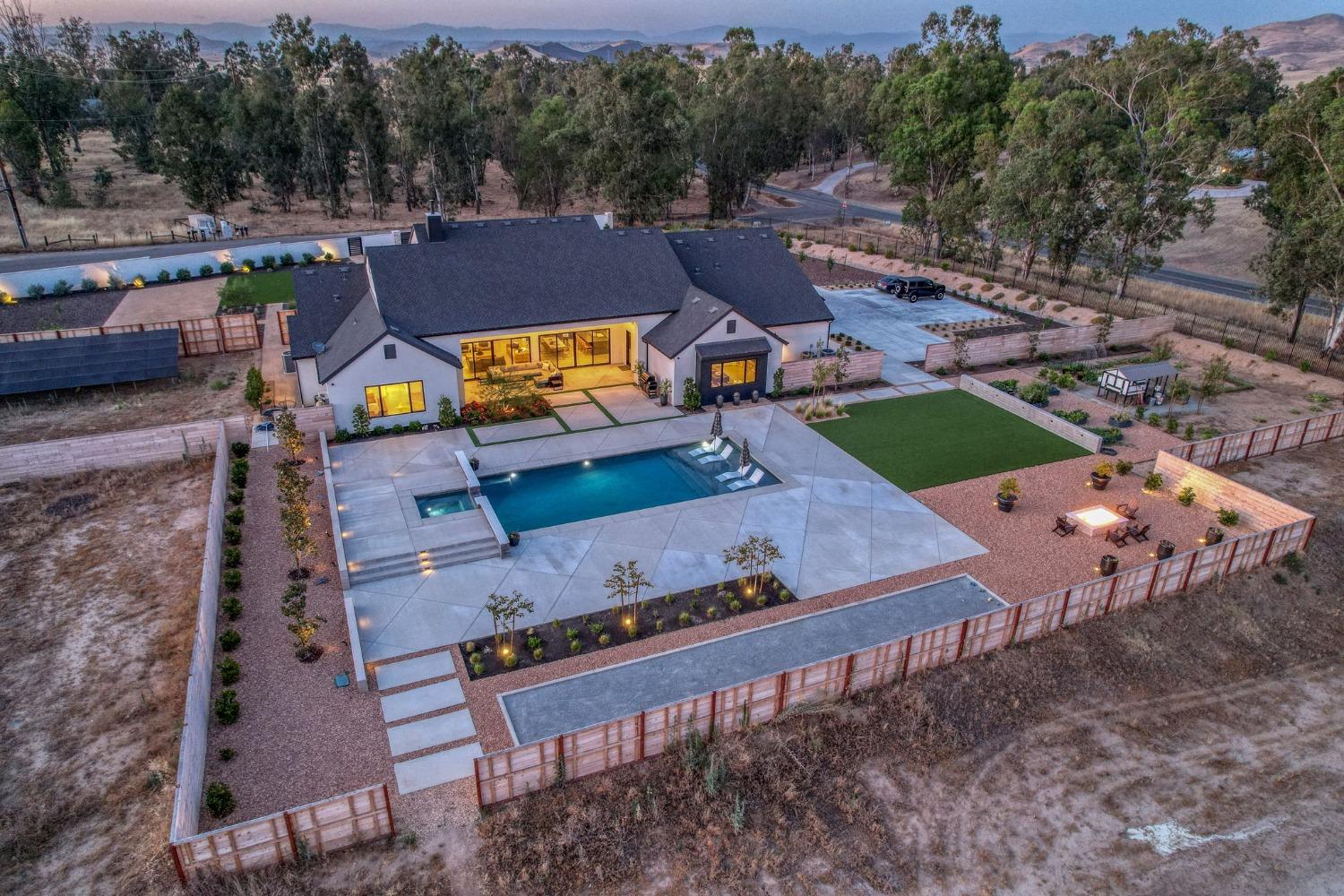 3895 East Reno Avenue Clovis, CA 93619 - Photo 55 of 67 an aerial view of a house with a garden