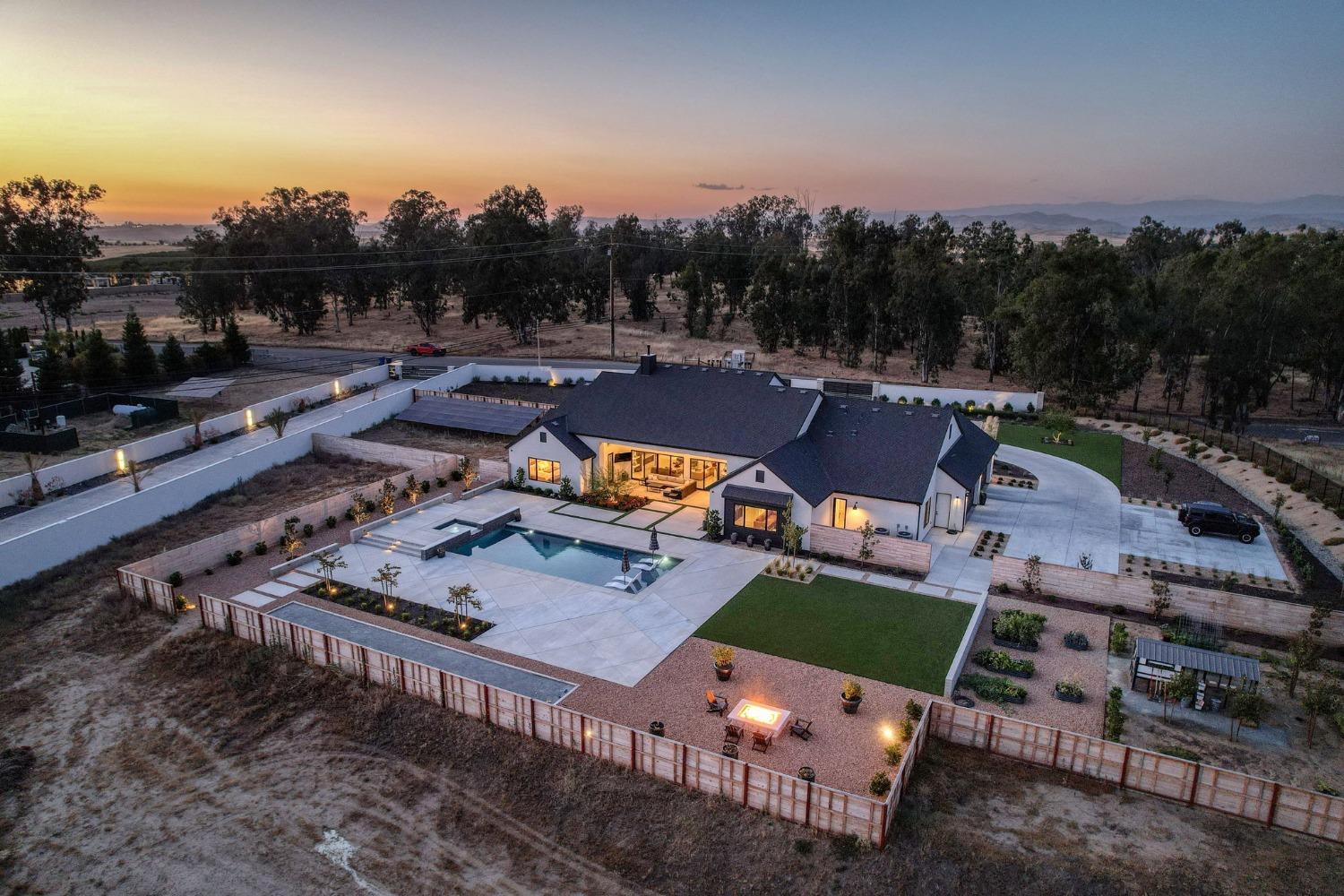 3895 East Reno Avenue Clovis, CA 93619 - Photo 56 of 67 an aerial view of a house with a garden