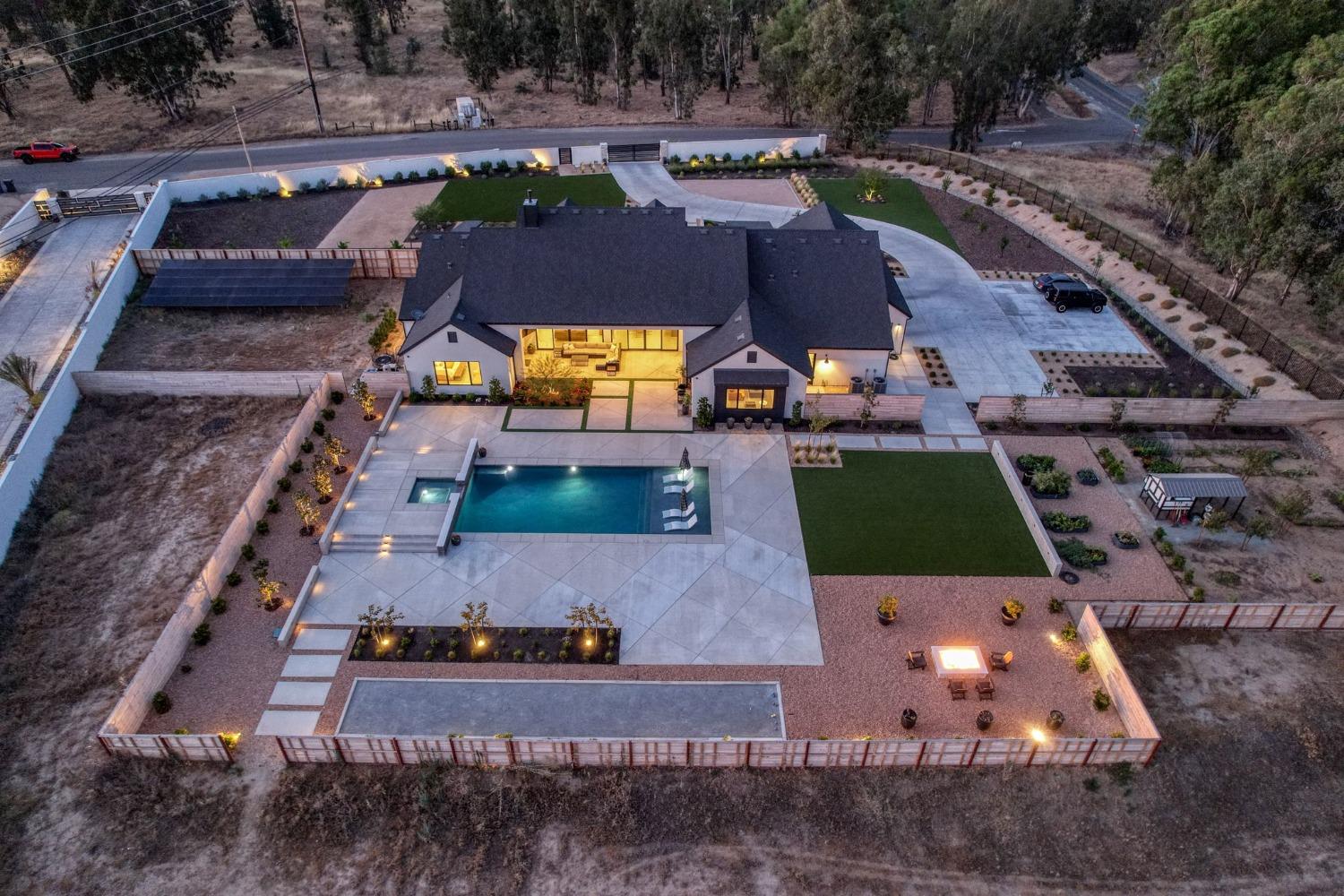 3895 East Reno Avenue Clovis, CA 93619 - Photo 58 of 67 an aerial view of a house with a swimming pool