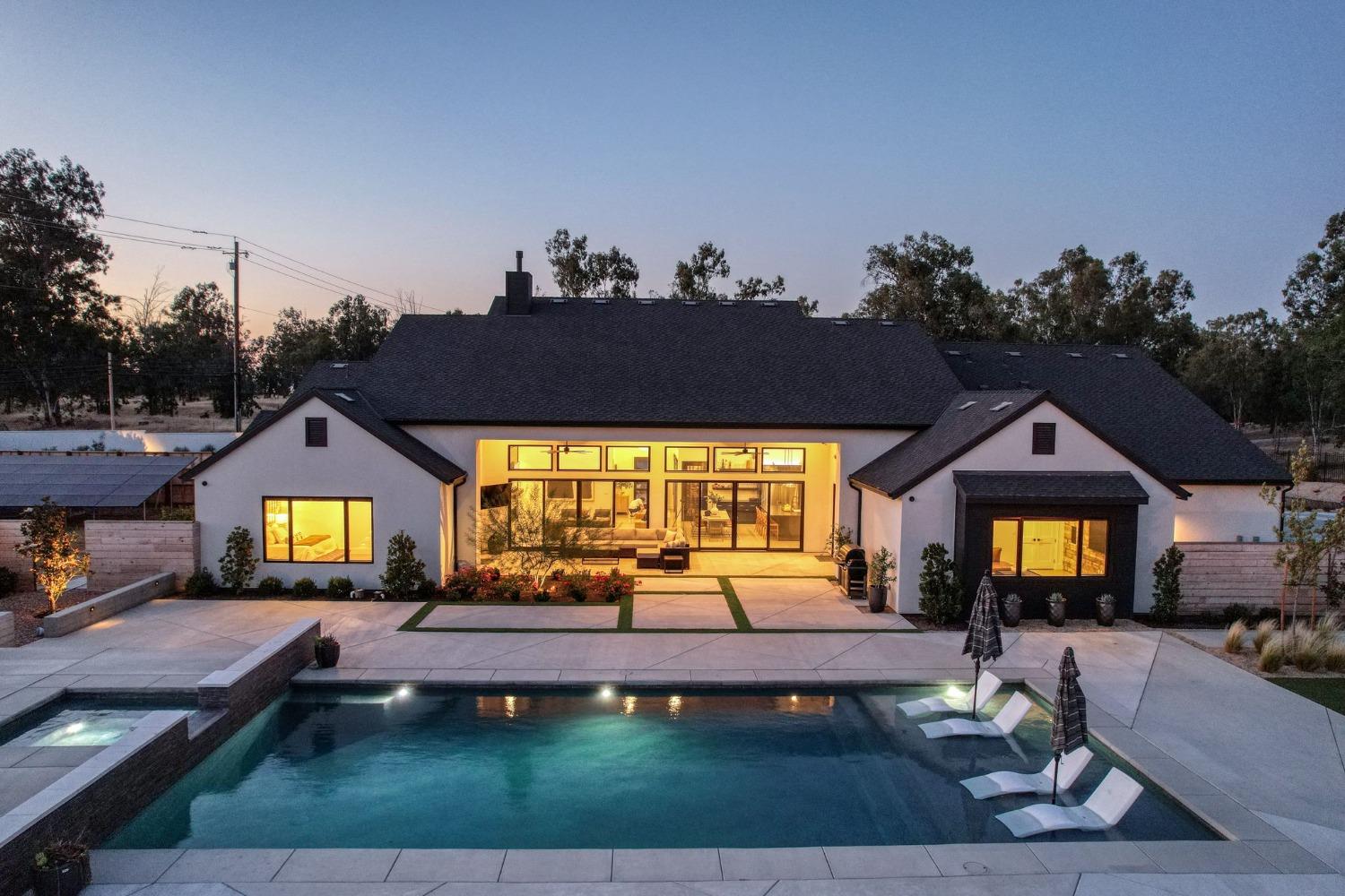 3895 East Reno Avenue Clovis, CA 93619 - Photo 59 of 67 a front view of a house with a garden