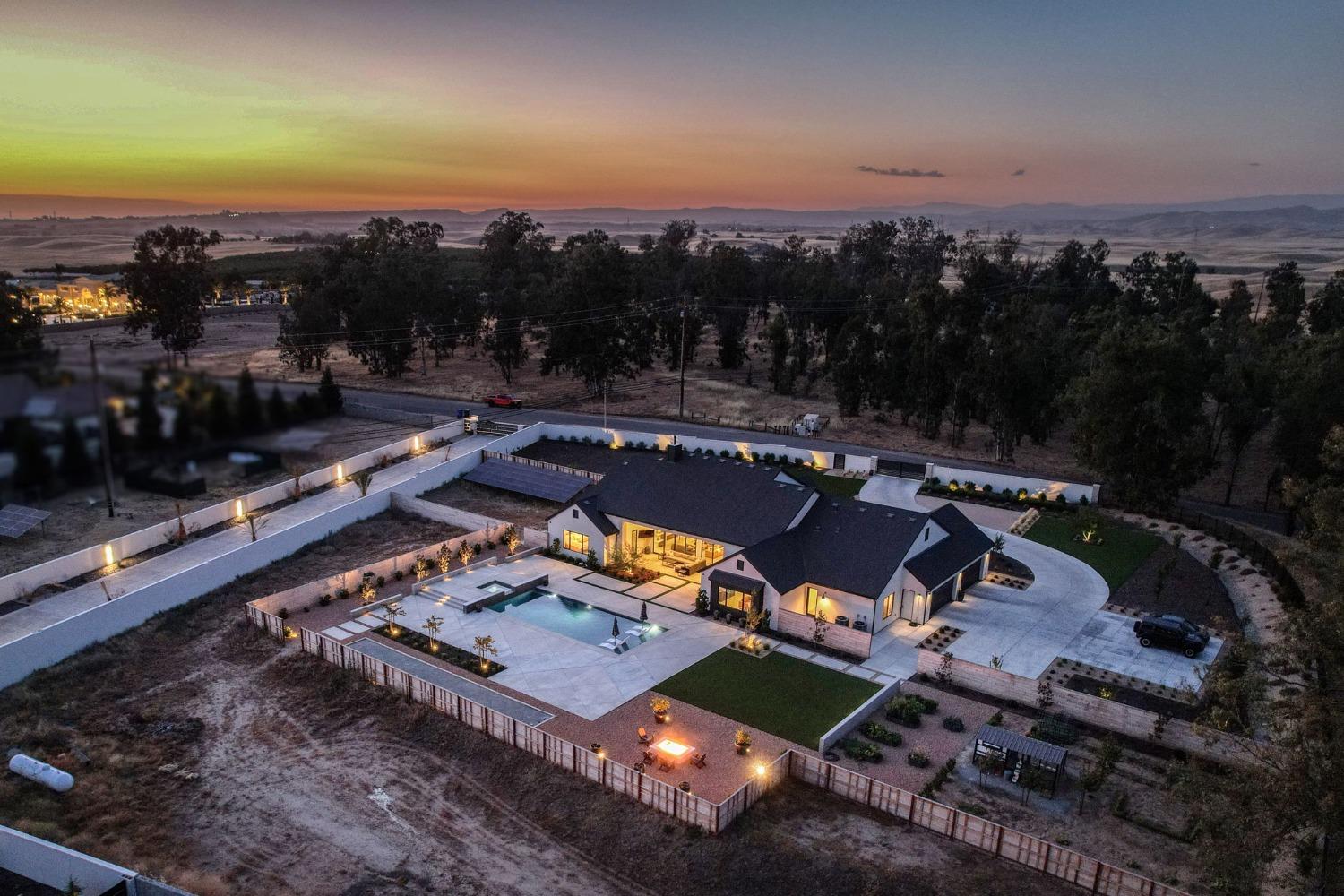 3895 East Reno Avenue Clovis, CA 93619 - Photo 60 of 67 an aerial view of a house with a garden