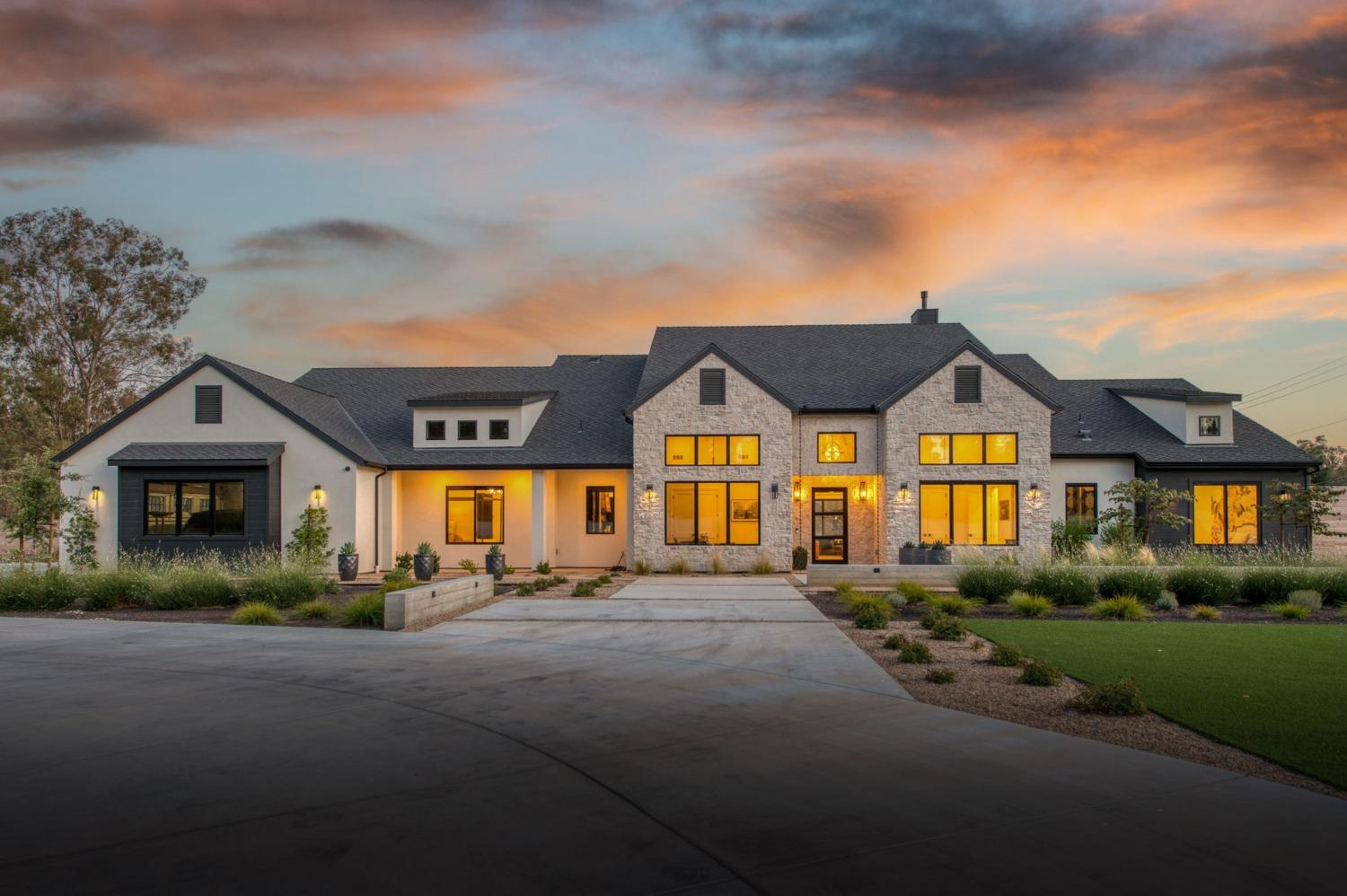 3895 East Reno Avenue Clovis, CA 93619 - Photo 61 of 67 a front view of a house with a garden and yard