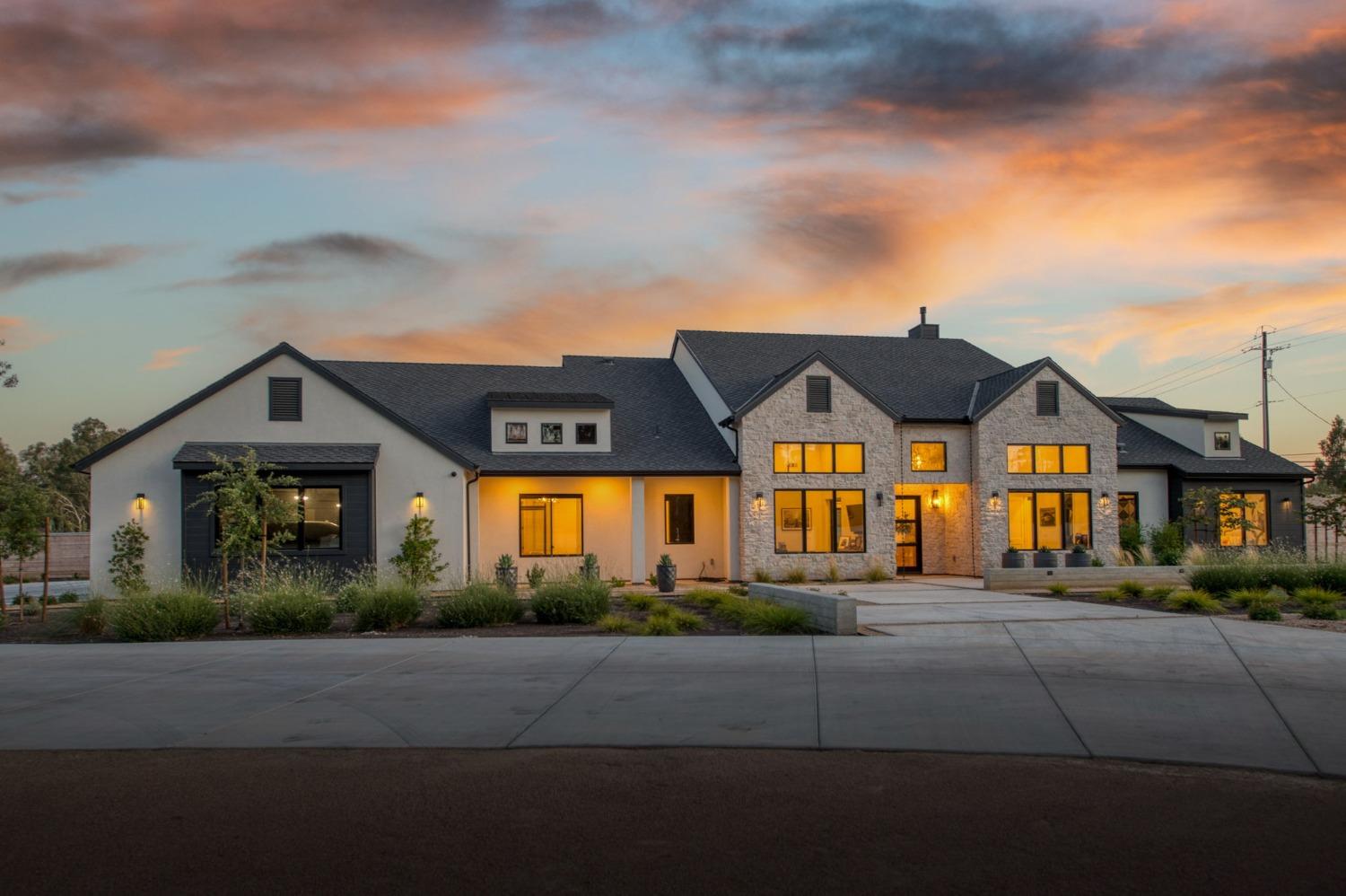 3895 East Reno Avenue Clovis, CA 93619 - Photo 62 of 67 a front view of a house with a yard
