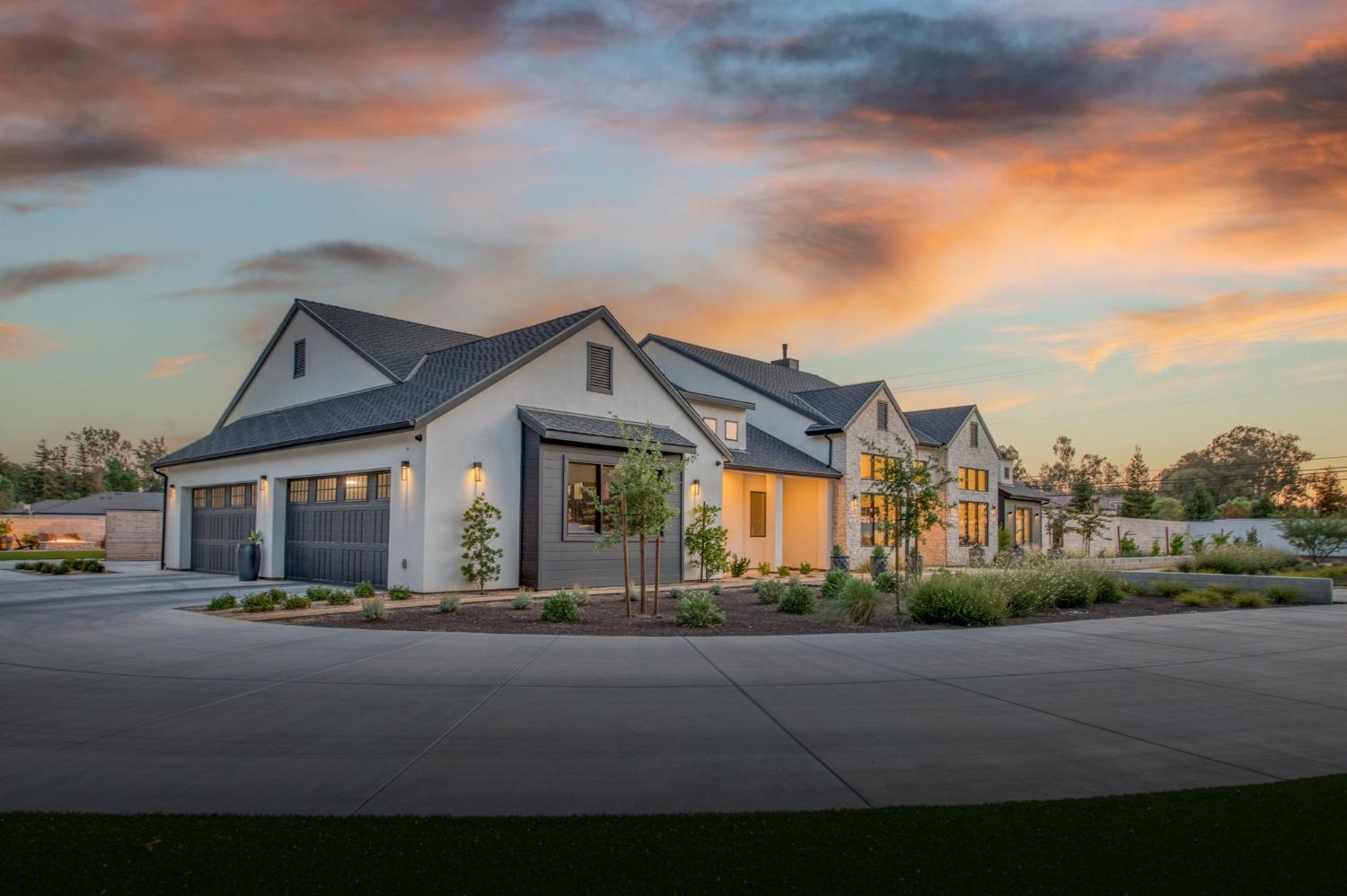 3895 East Reno Avenue Clovis, CA 93619 - Photo 63 of 67 a front view of a house with a garden