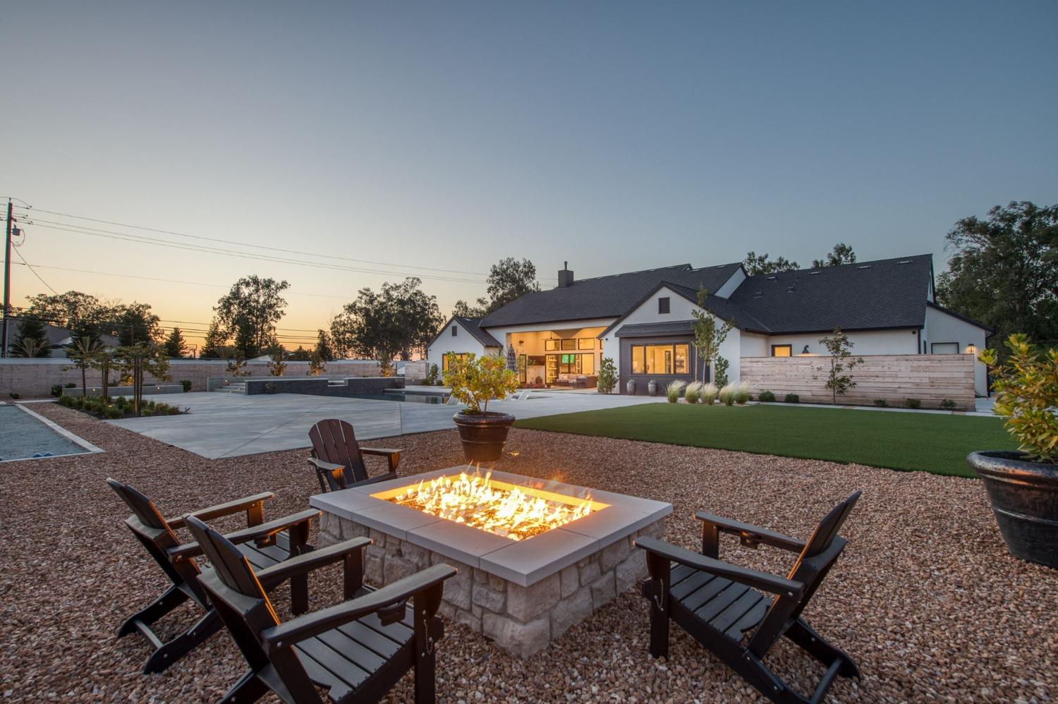 3895 East Reno Avenue Clovis, CA 93619 - Photo 65 of 67 a view of a house with backyard and a chair