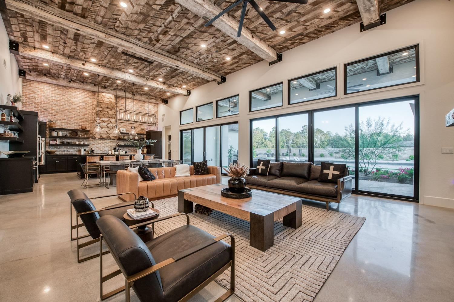 3895 East Reno Avenue Clovis, CA 93619 - Photo 9 of 67 a living room with furniture and a large window