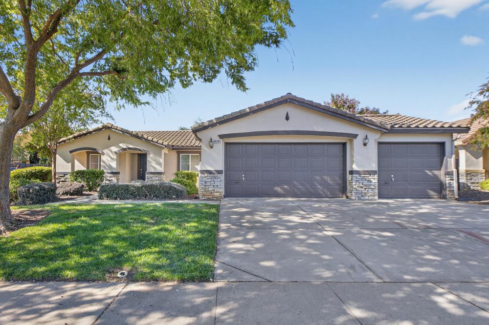 4266 Middlebury Way Mather, CA 95655 - Photo 1 of 1 a front view of a house with a garden