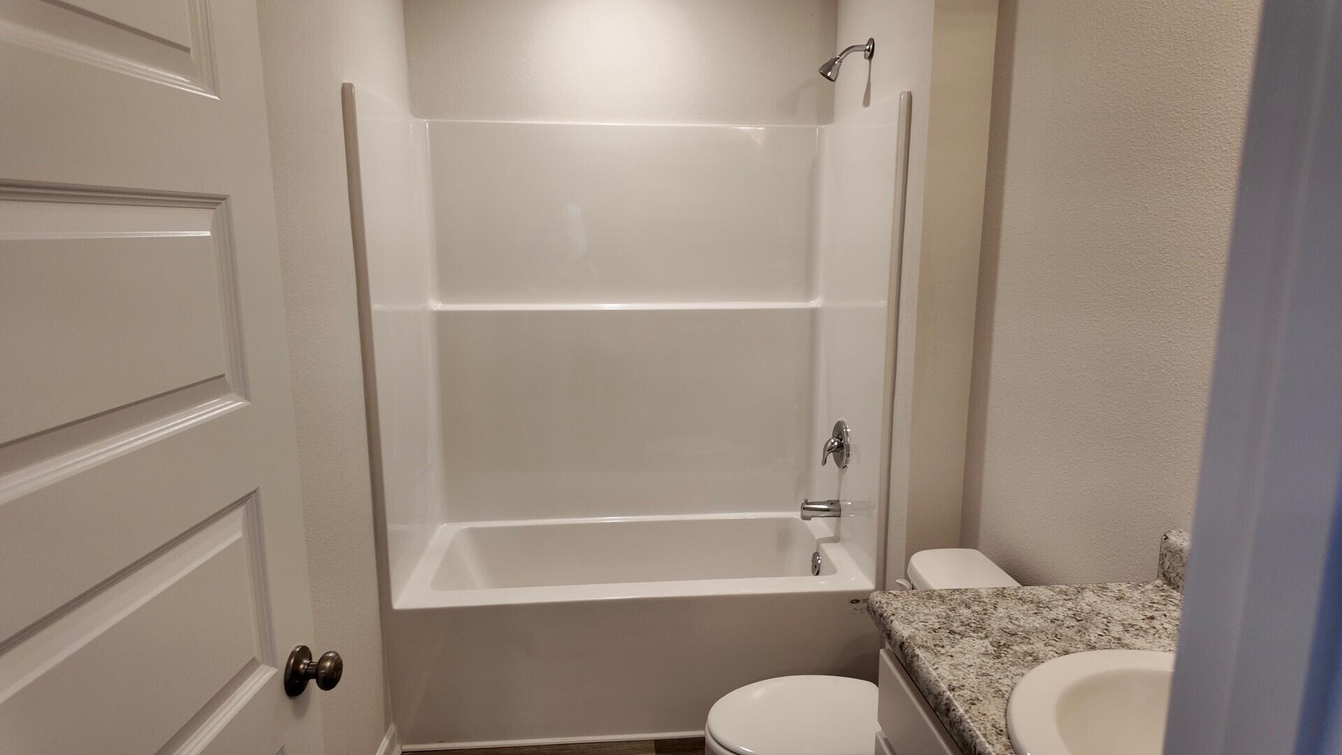 6356 Firefly Drive Milton, FL 32583 - Photo 28 of 44 a bathroom with a shower and a toilet