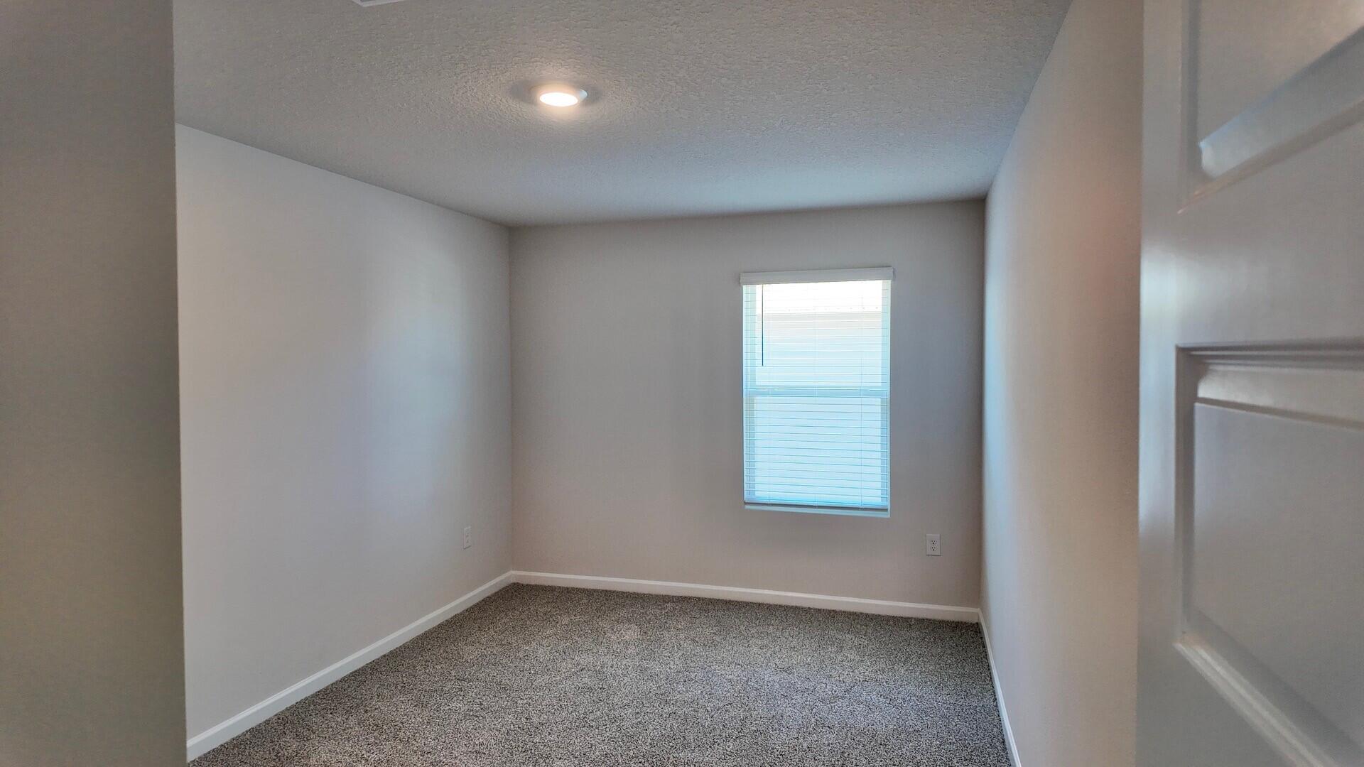 6356 Firefly Drive Milton, FL 32583 - Photo 29 of 44 an empty room with windows