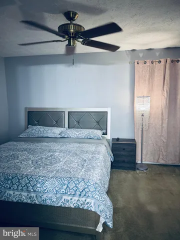 a bedroom with a bed and a table