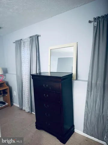 a bathroom with a sink a mirror and vanity