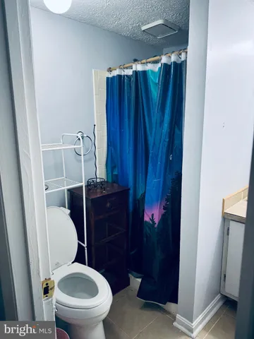 a bathroom with a toilet and a sink