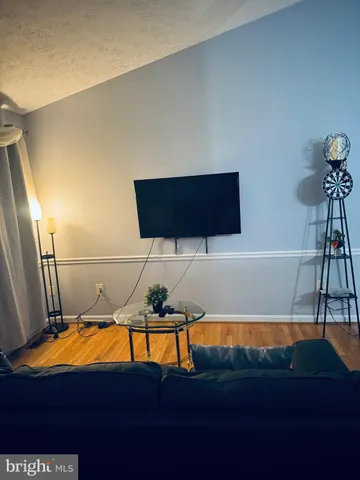 a bed room with a bed and a chair