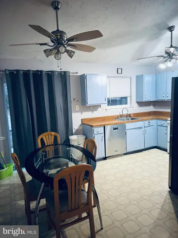 a table and chairs in a kitchen