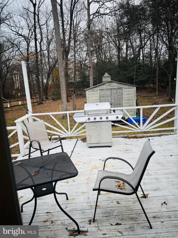a view of a chairs and tables on the roof deck