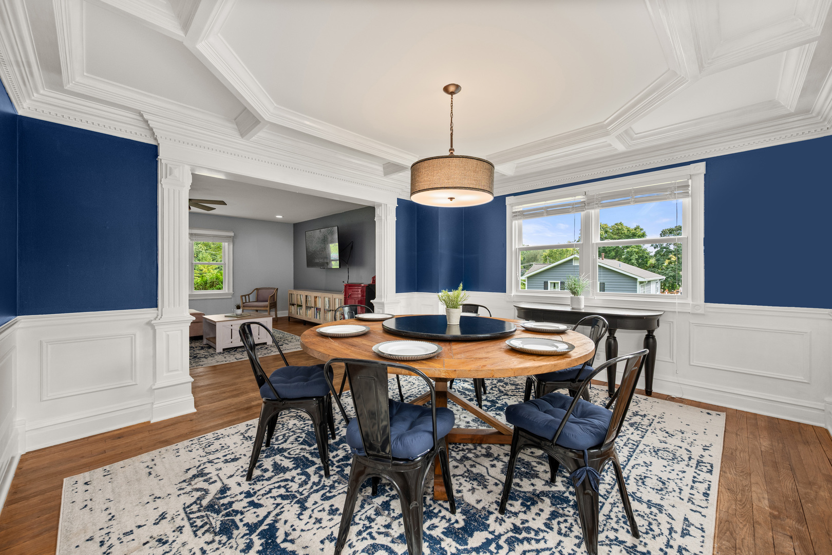 40w897 Brown Road St. Charles, IL 60175 - Photo 16 of 35 a view of a dining room and livingroom with furniture wooden floor a rug a painting and a chandelier
