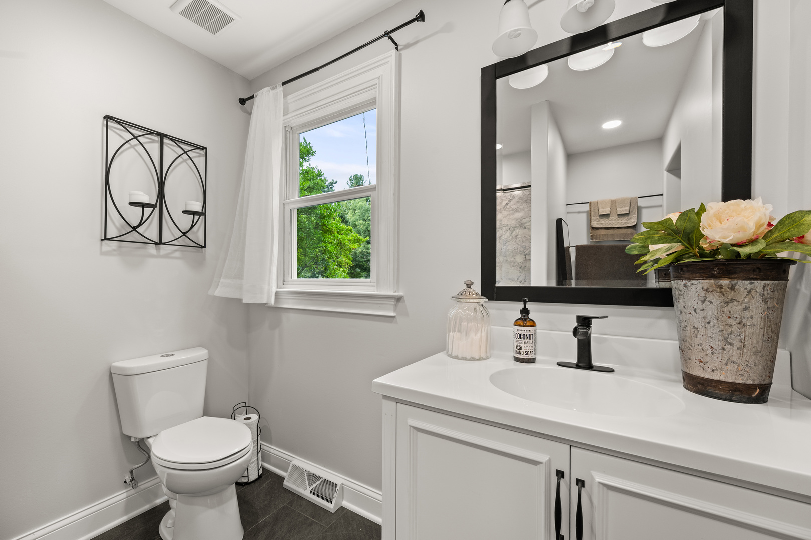 40w897 Brown Road St. Charles, IL 60175 - Photo 22 of 35 a bathroom with a toilet sink and mirror