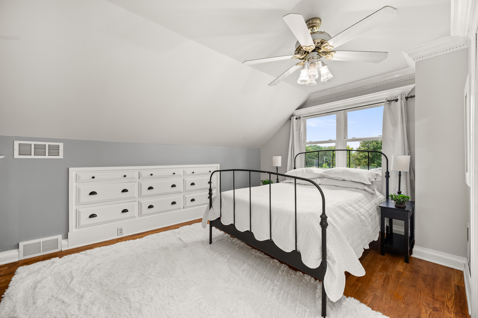 40w897 Brown Road St. Charles, IL 60175 - Photo 23 of 35 a bedroom with a bed and a chandelier